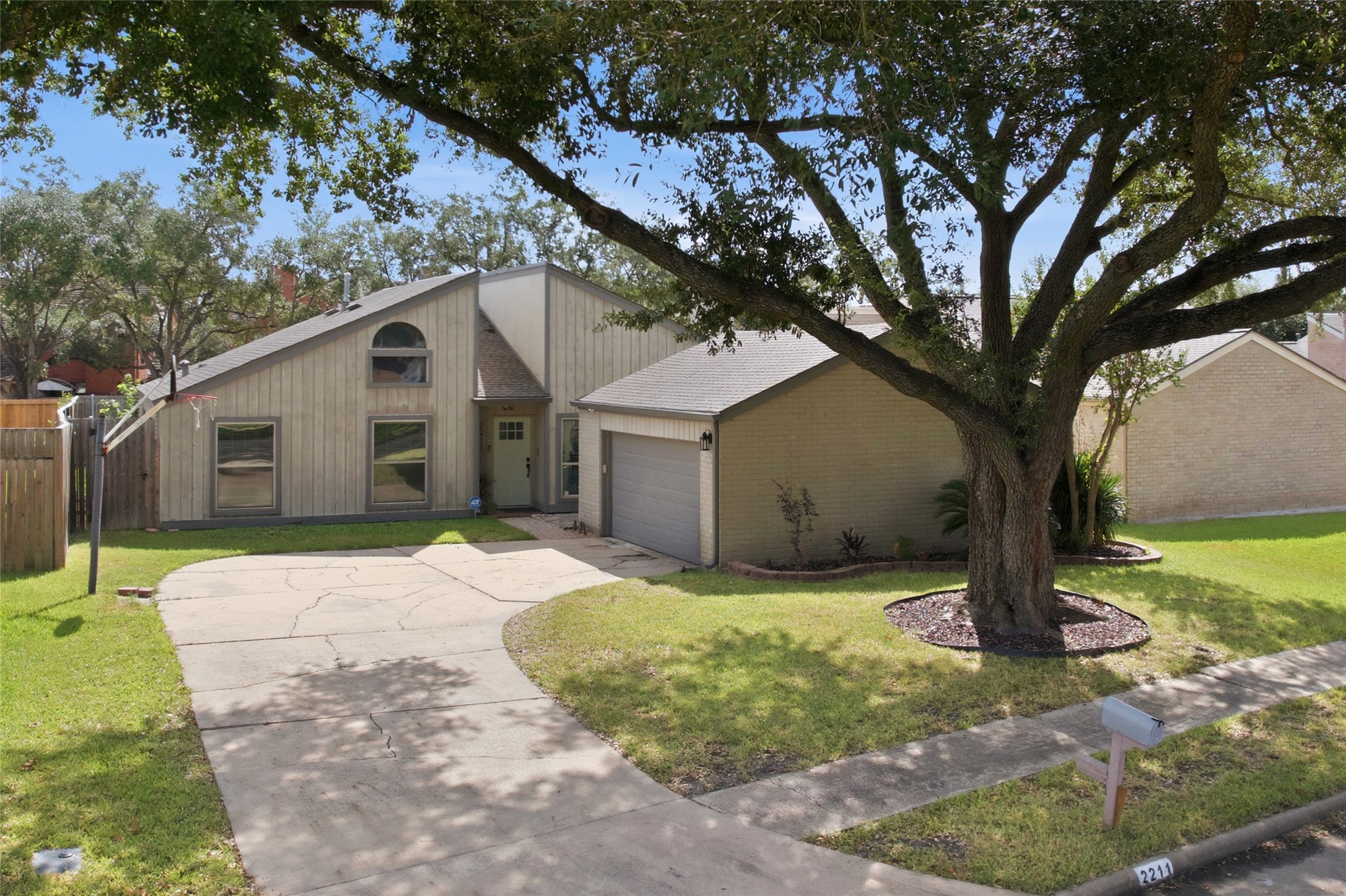 Long driveway leads to a two-car garage, providing plenty of parking space. Long driveway leads to a two-car garage, providing plenty of parking space.