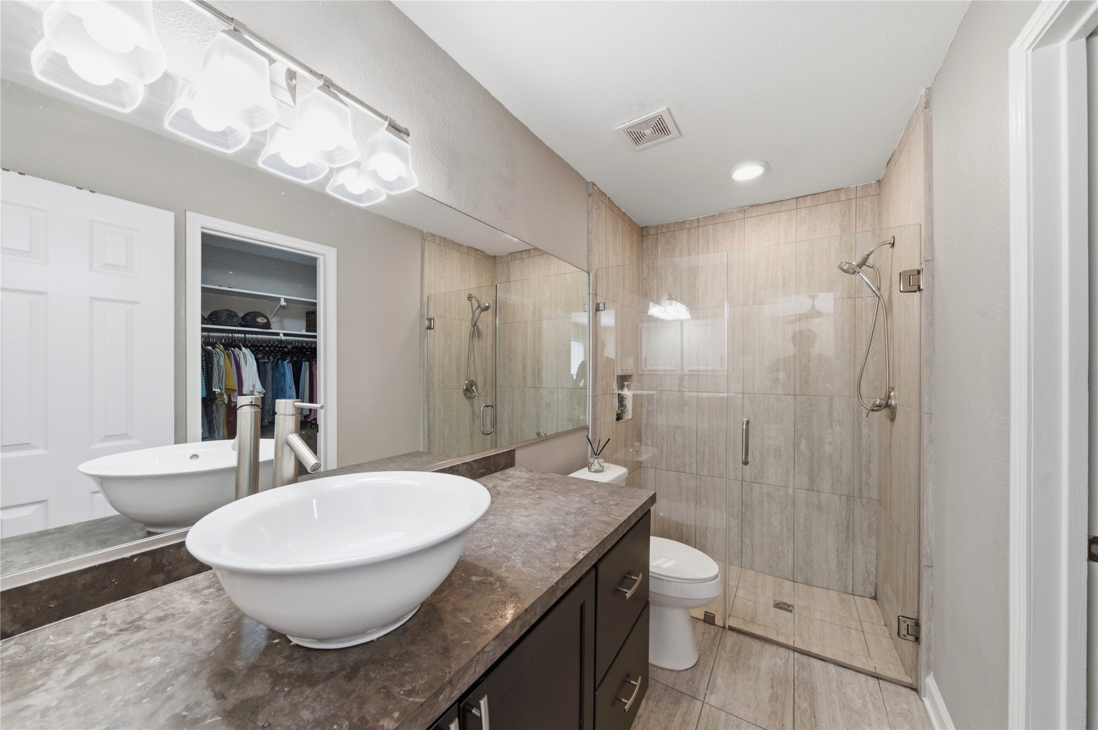 Step into your beautifully updated primary bathroom.