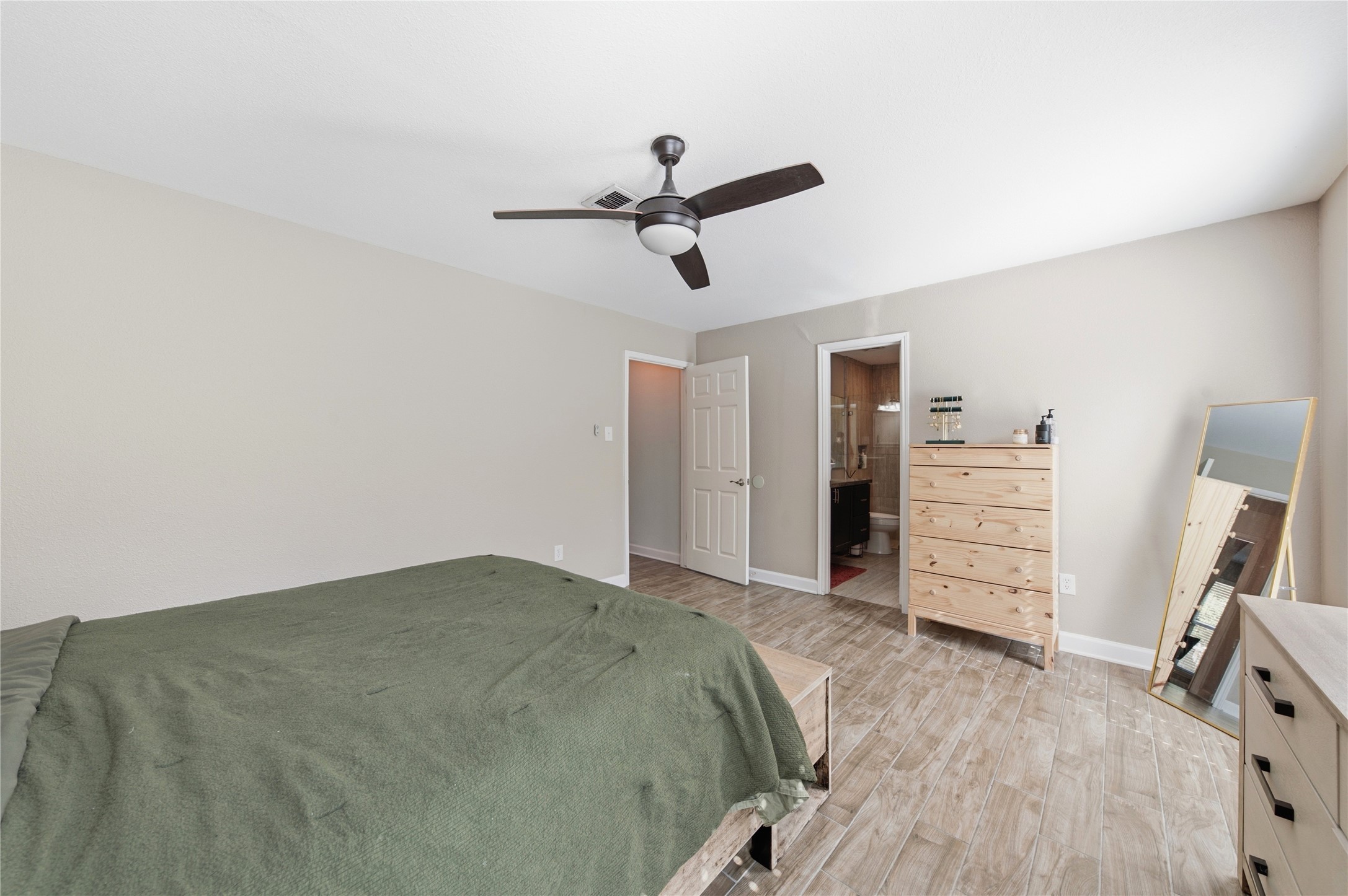The primary bedroom features an en-suite full bath and walk-in closet.