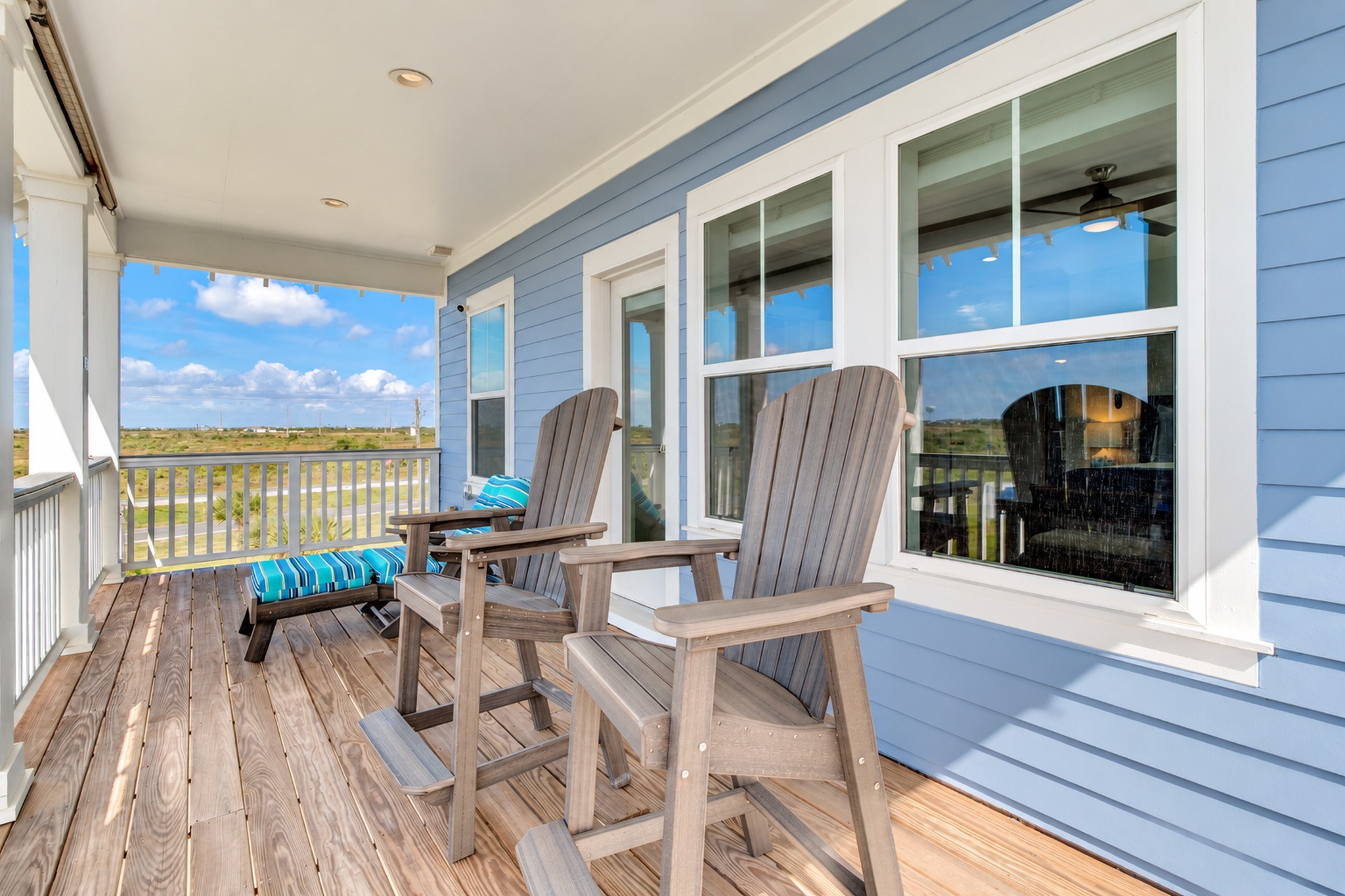 Private deck off the primary bedroom, perfect for enjoying the coastal breeze and beach views