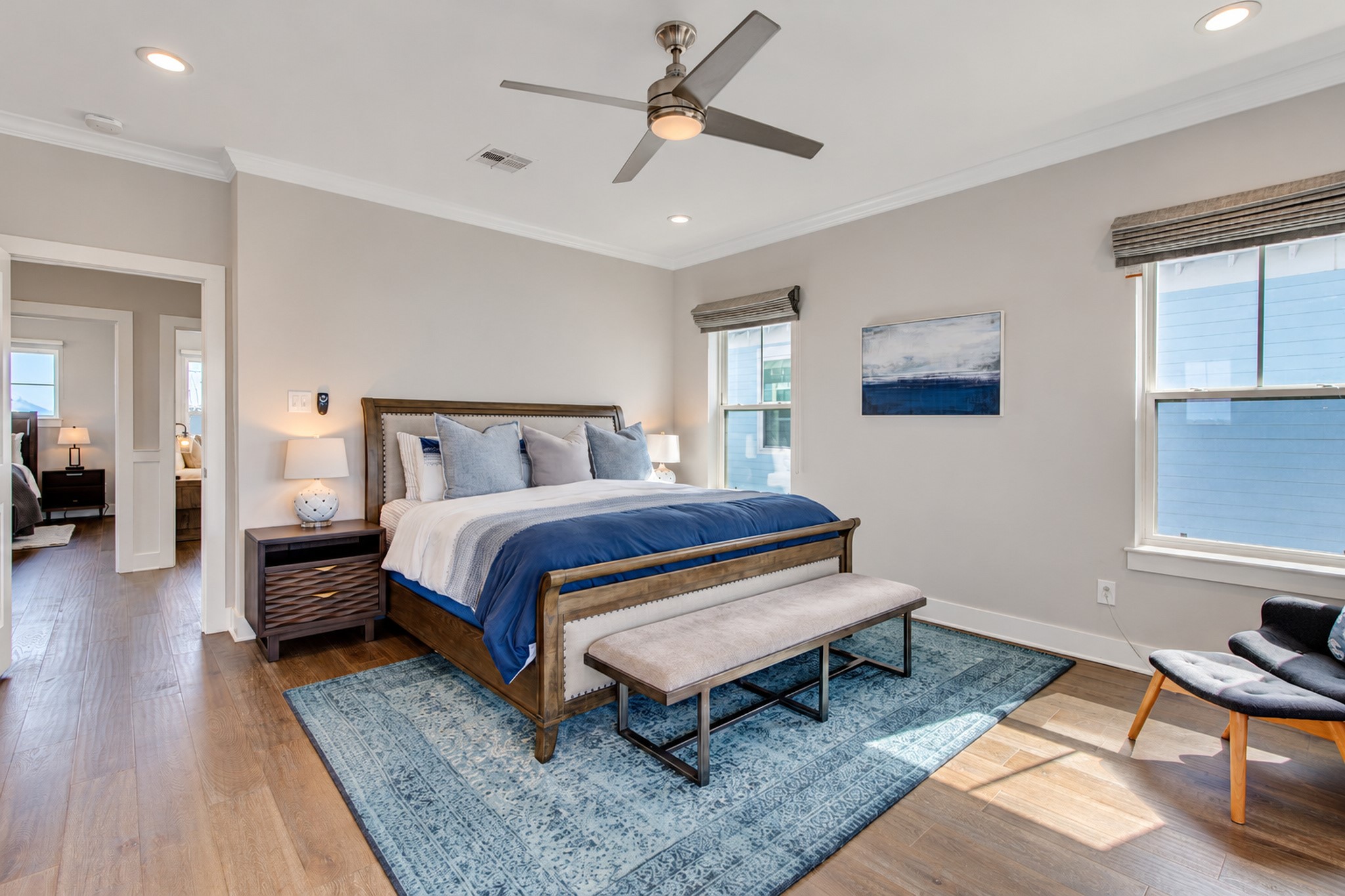 At the top of the stairs to your right, on the southwest side of the home, is the primary bedroom.