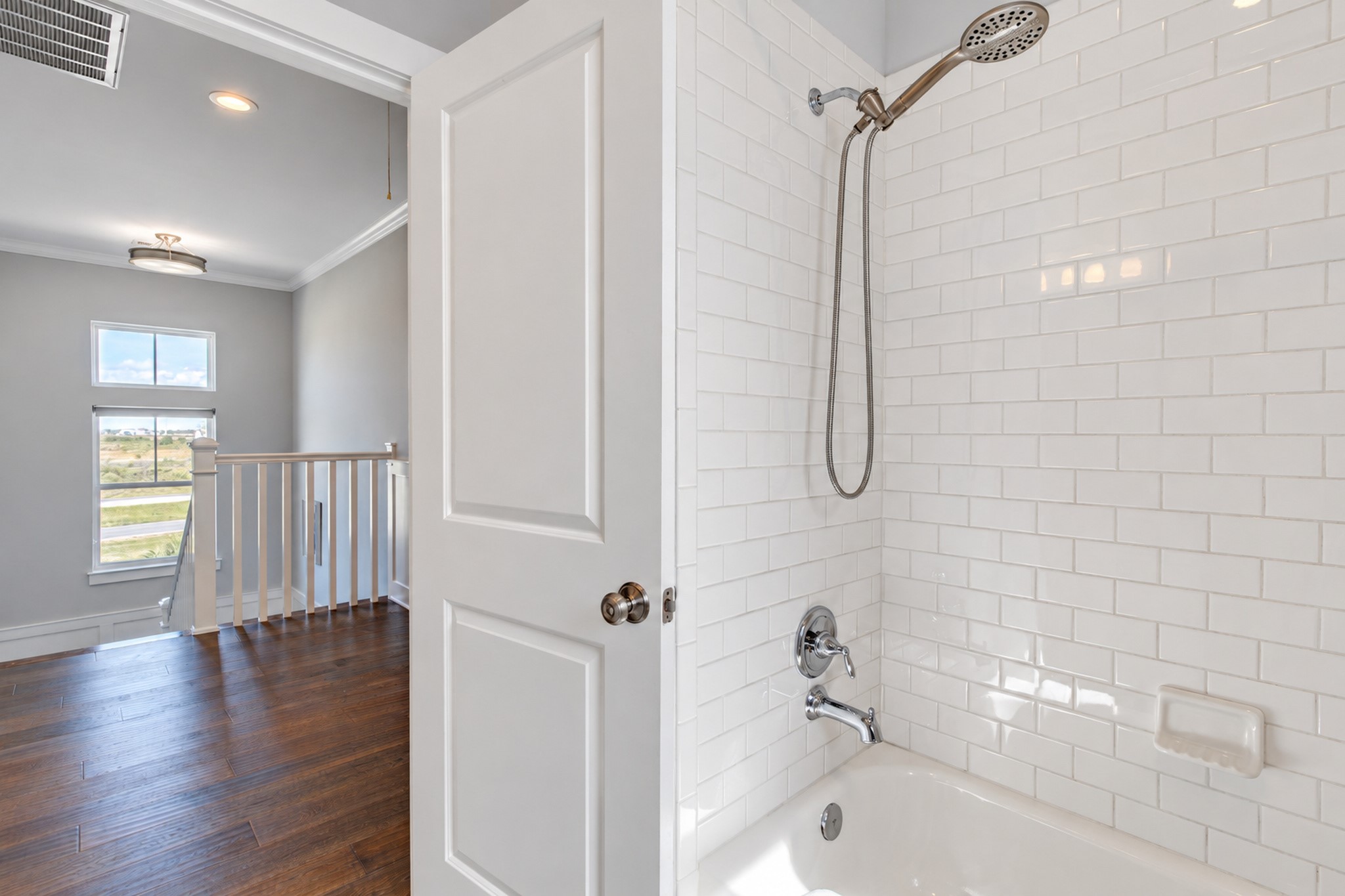 This bathroom features a tub/shower combo.