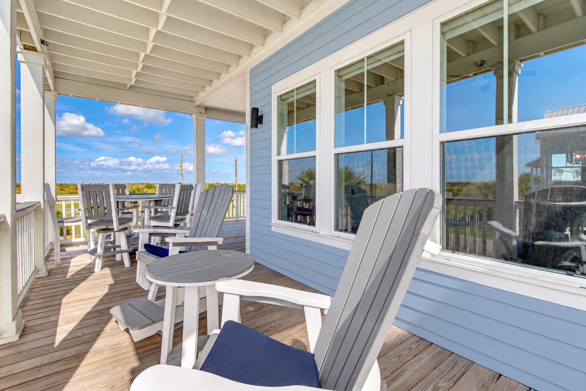 Relax on the deck just off the living area and enjoy beach views