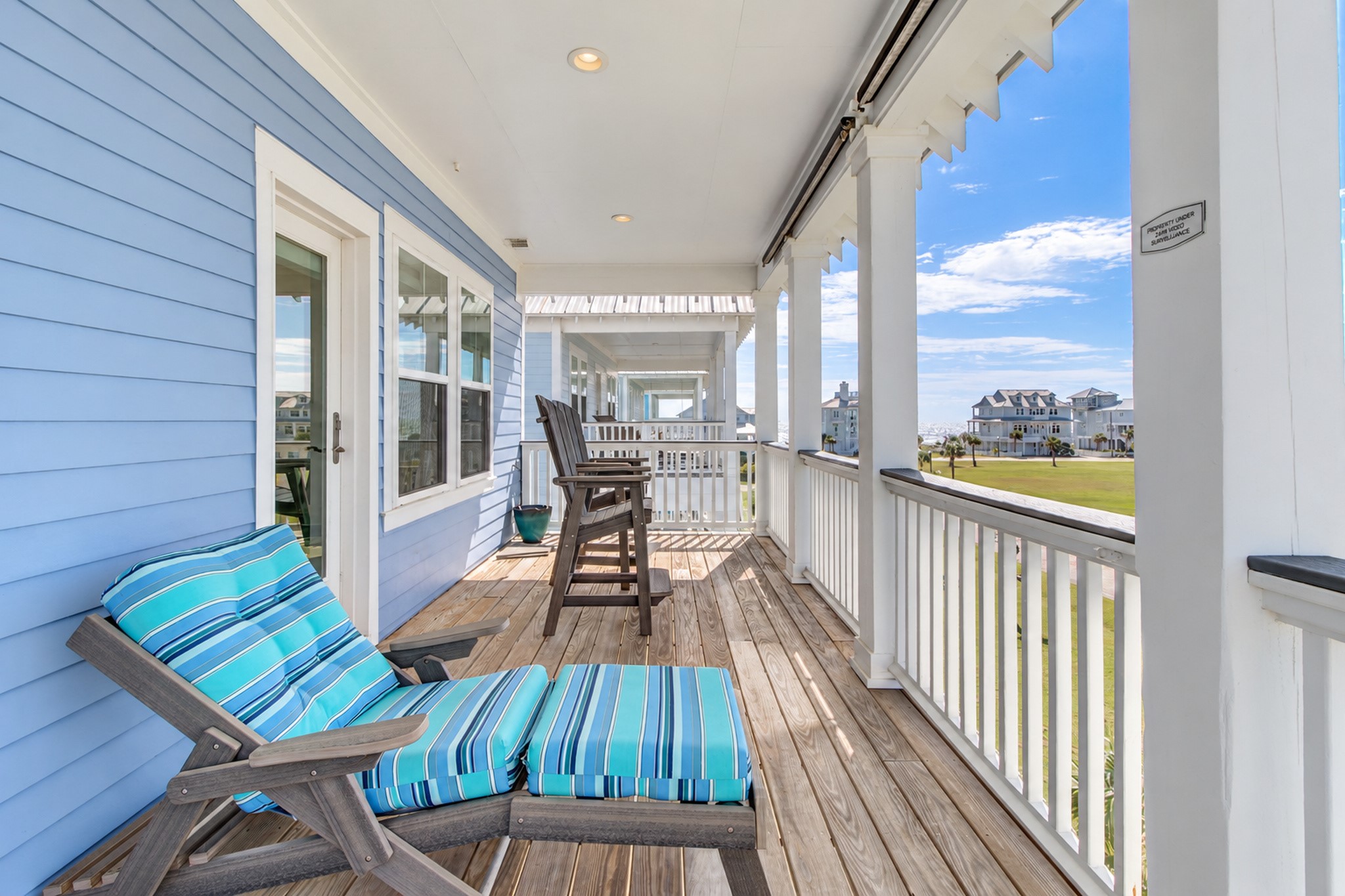 The covered deck located off of the primary bedroom. You will love enjoying a cup of coffee and the view each morning.