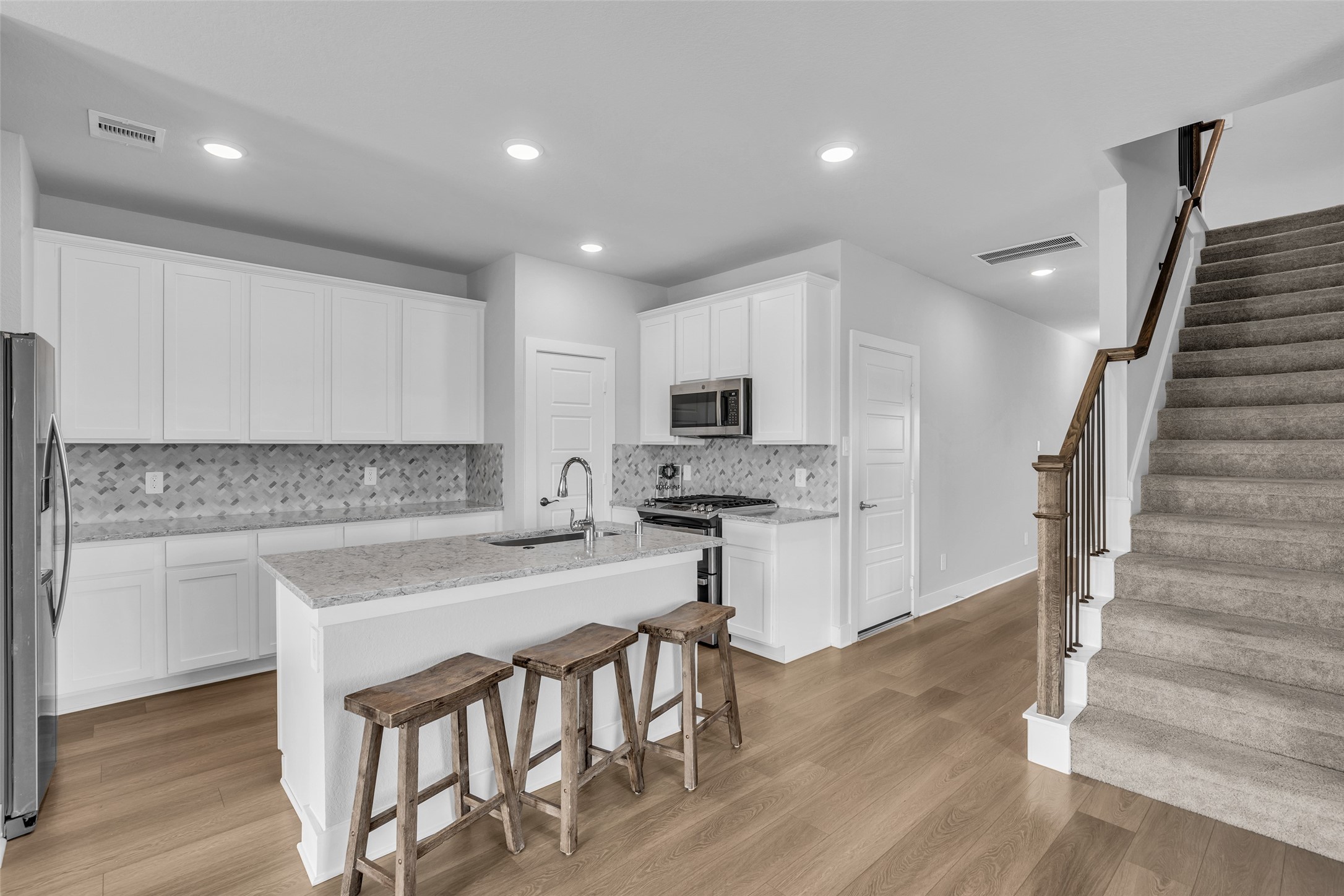 Kitchen open to dining area and living space