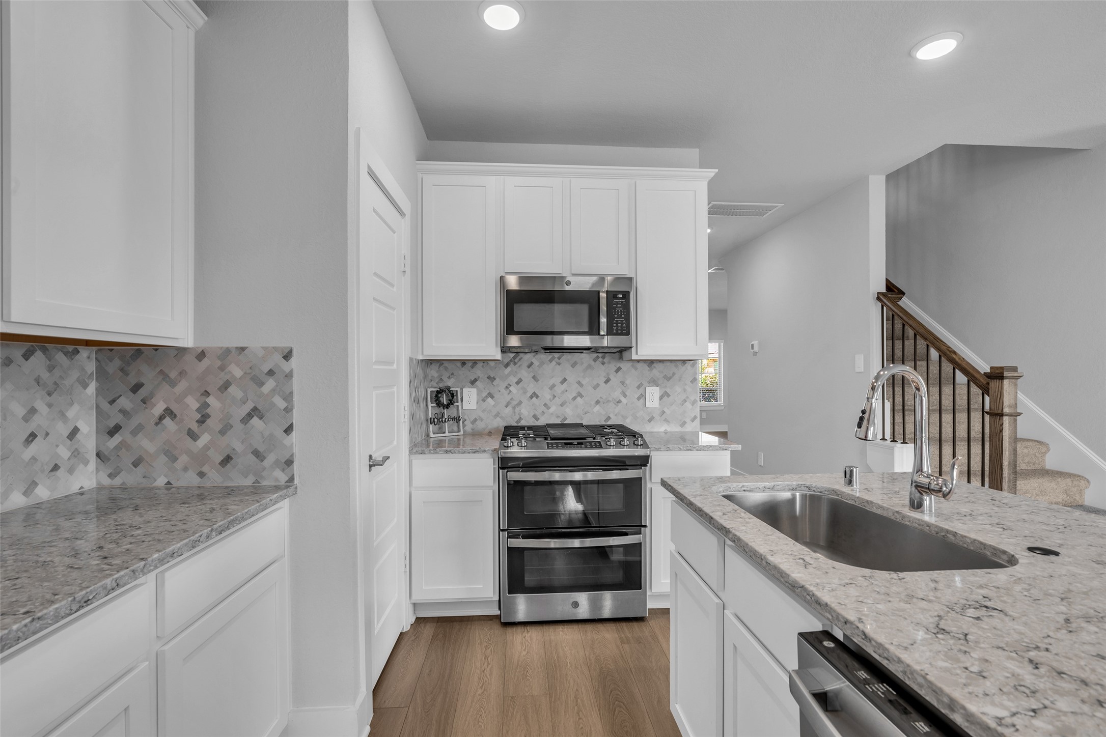 Gorgeous kitchen with double ovens and microwave