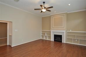 Living room with fireplace and bookshelves
