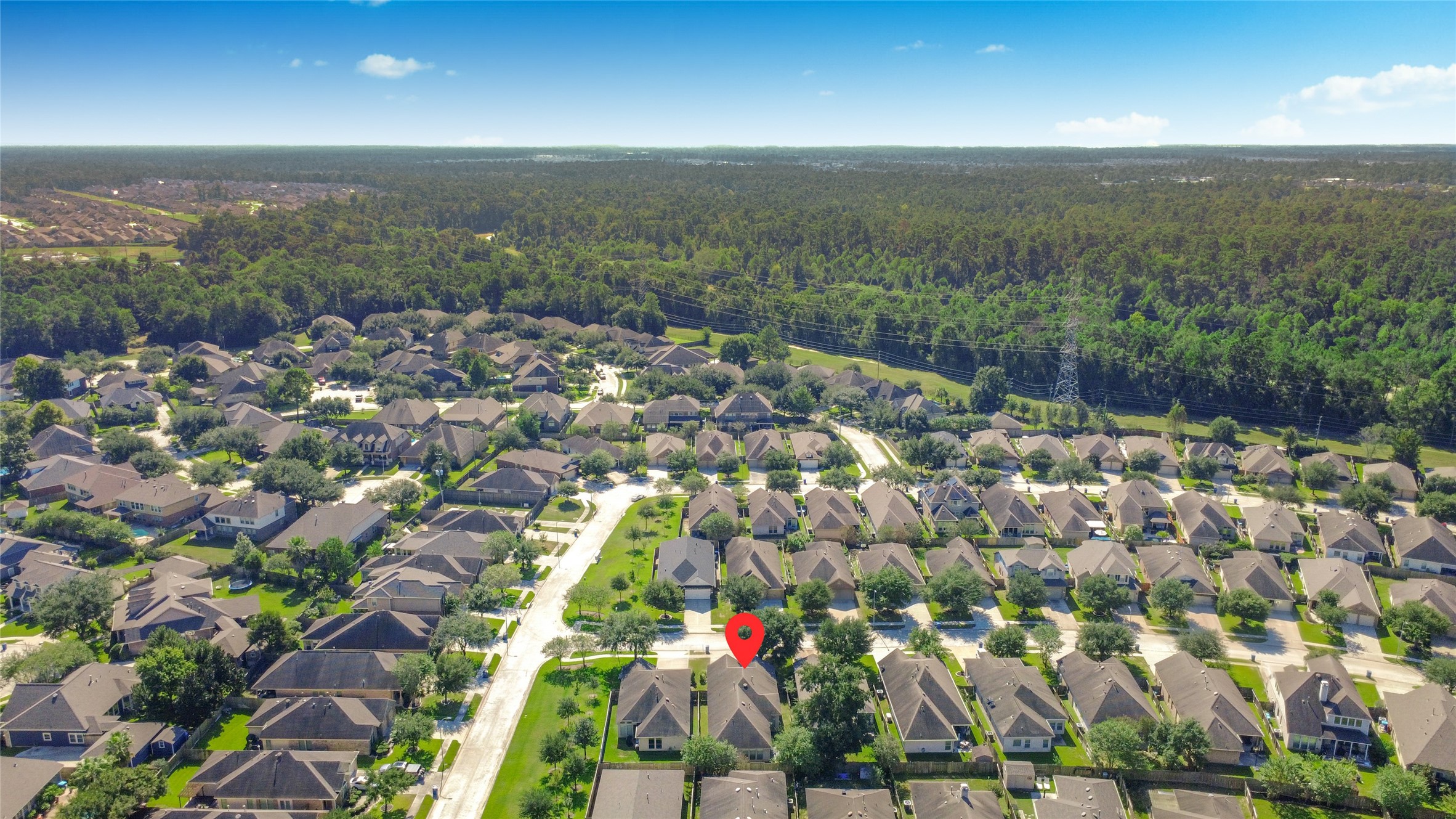 Charming home nestled in a picturesque neighborhood, surrounded by lush greenery and tree-lined streets, offering a serene suburban living experience.