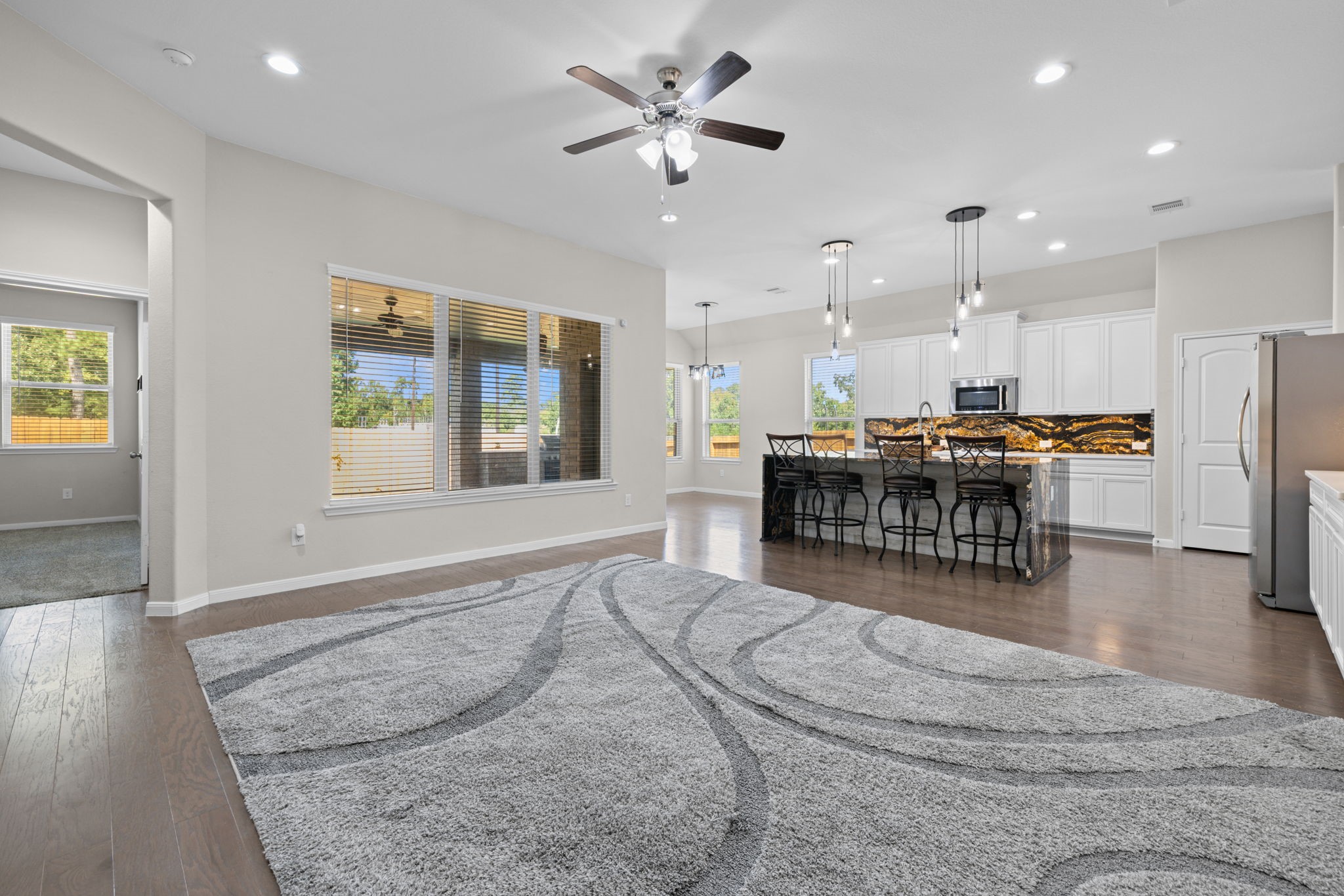 Looking towards the kitchen you can see the wood floors and open plan