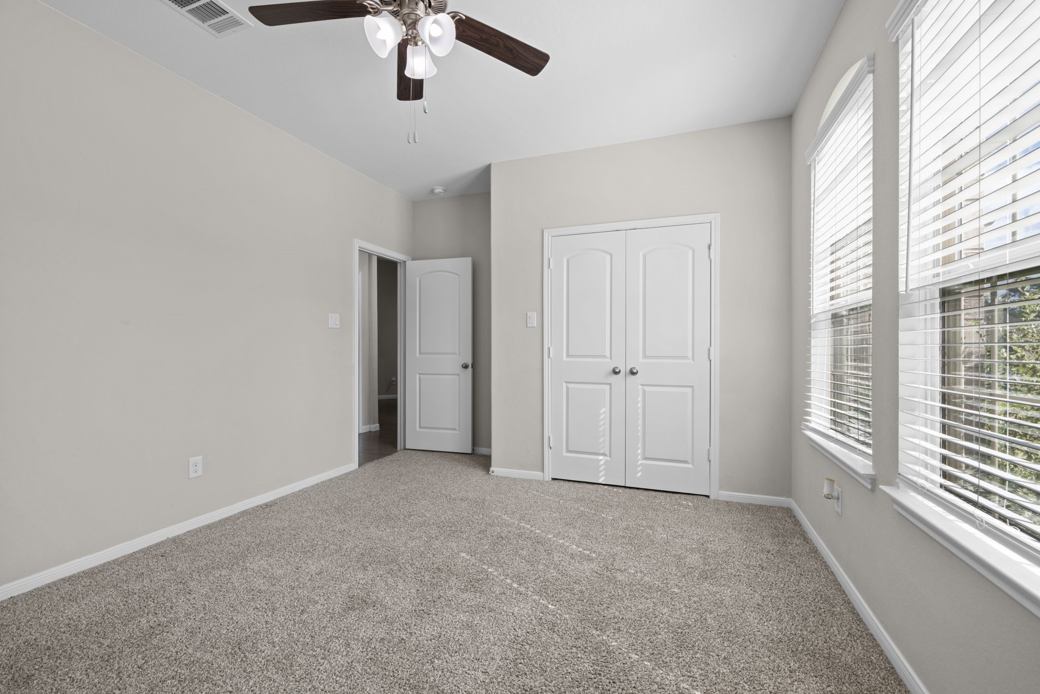 These are well sized rooms with nice closets and ceiling fans
