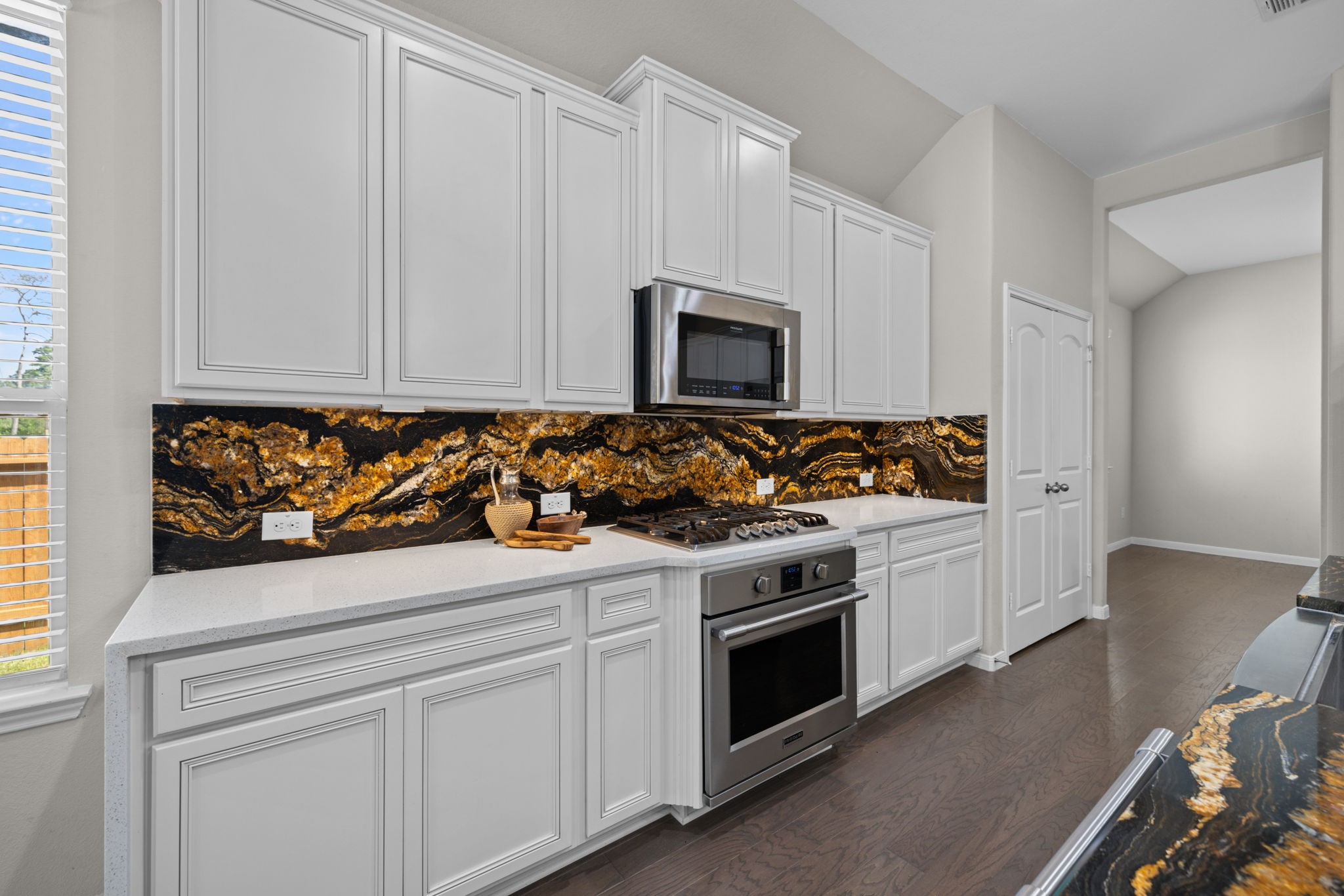 The gas cook top is convenient and the oven and microwave are also well placed in this kitchen. Cooking is a breeze!