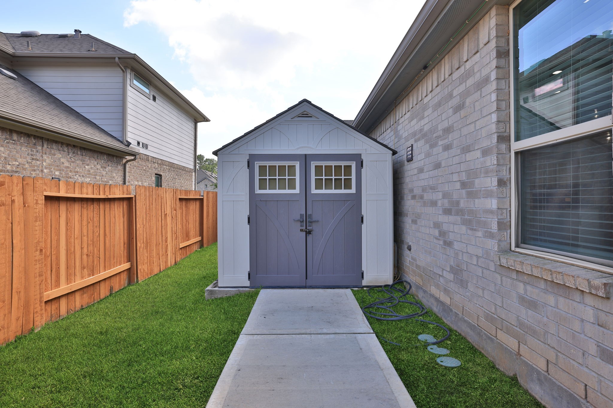The shed has a concrete walk for easy use and is on a slab
