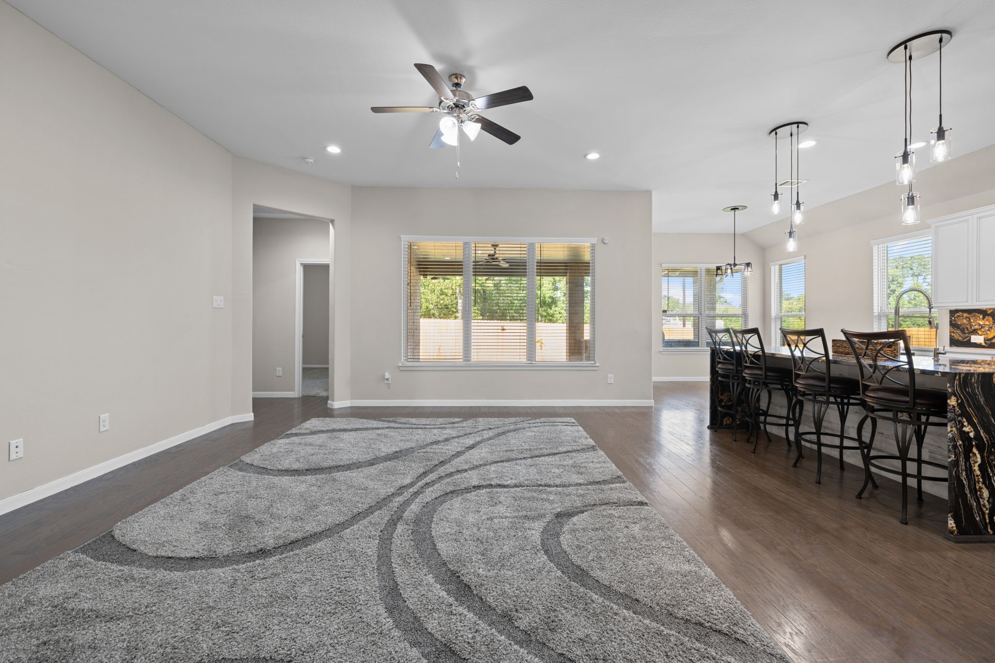 Such a spacious family room with high ceilings and great views out to the patio nad yard