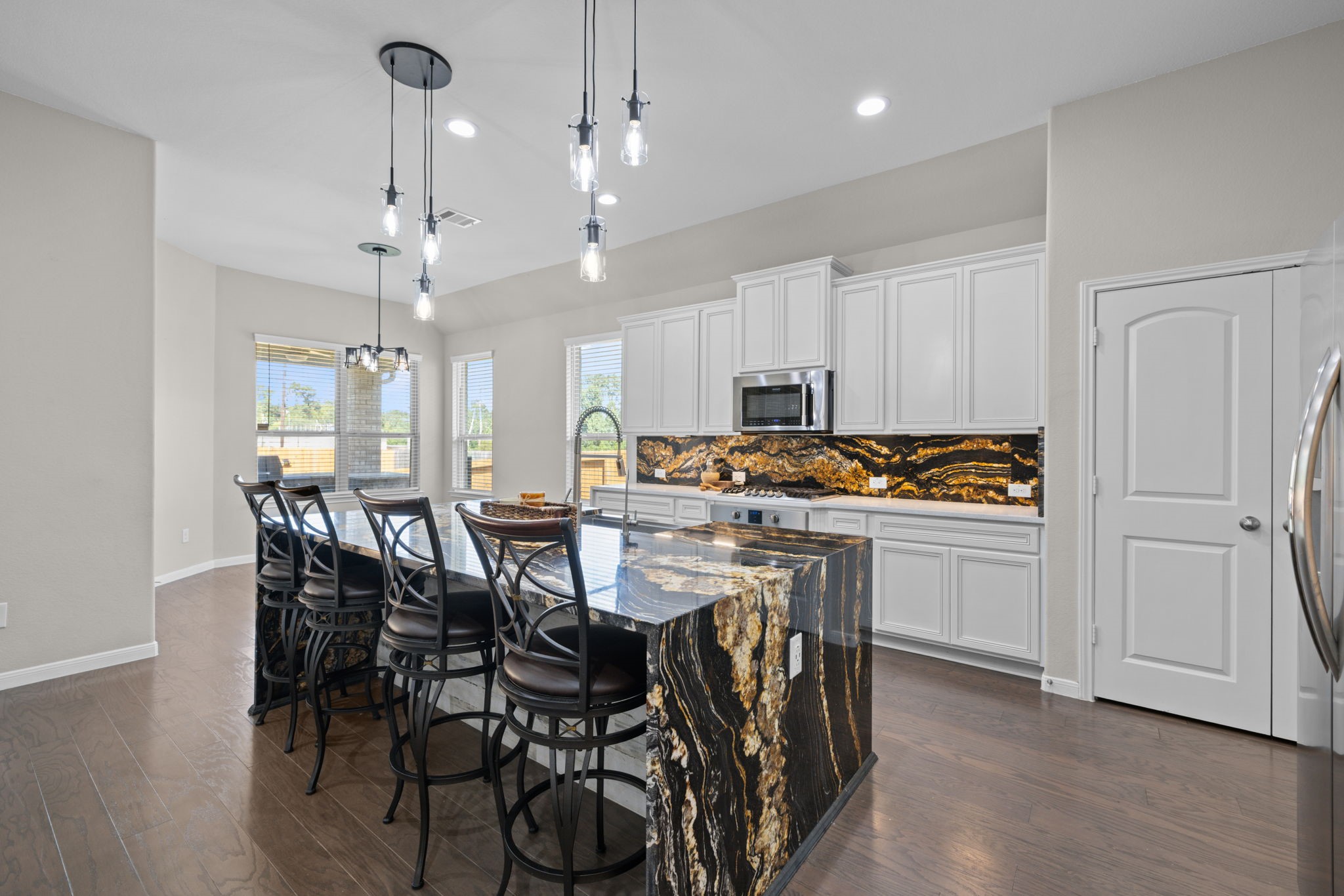 The large island will hold bar stools for informal dining