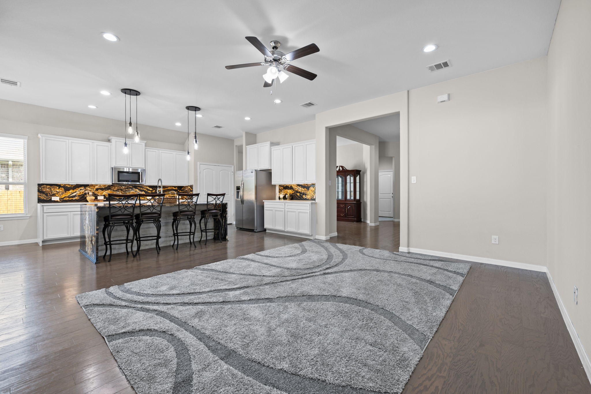 This area has plenty of room for your large furniture and TV. This space moves freely between the family room, kitchen and outdoor area so it's great for entertaining