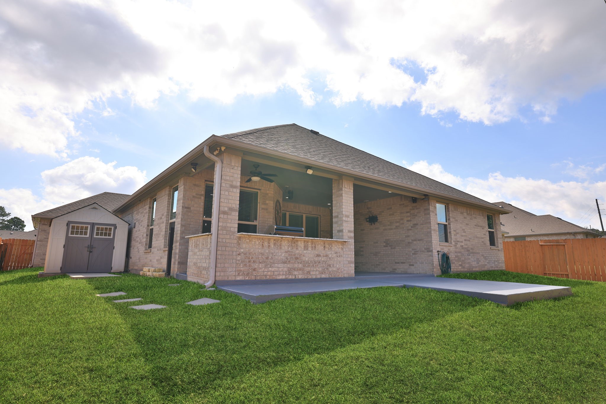 This all brick home is easy maintenance and the shed holds plenty of yard tools or garage overflow