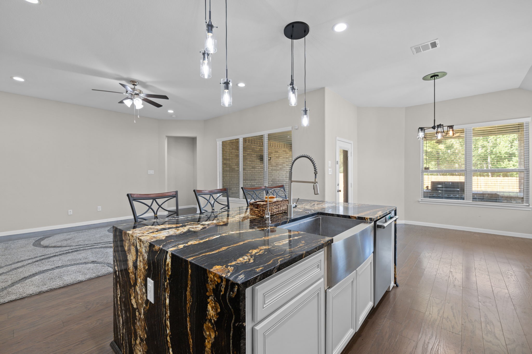 You'll enjoy cooking or entertaining in this kitchen and looking out towards the family room area where you can be involved in anything going on
