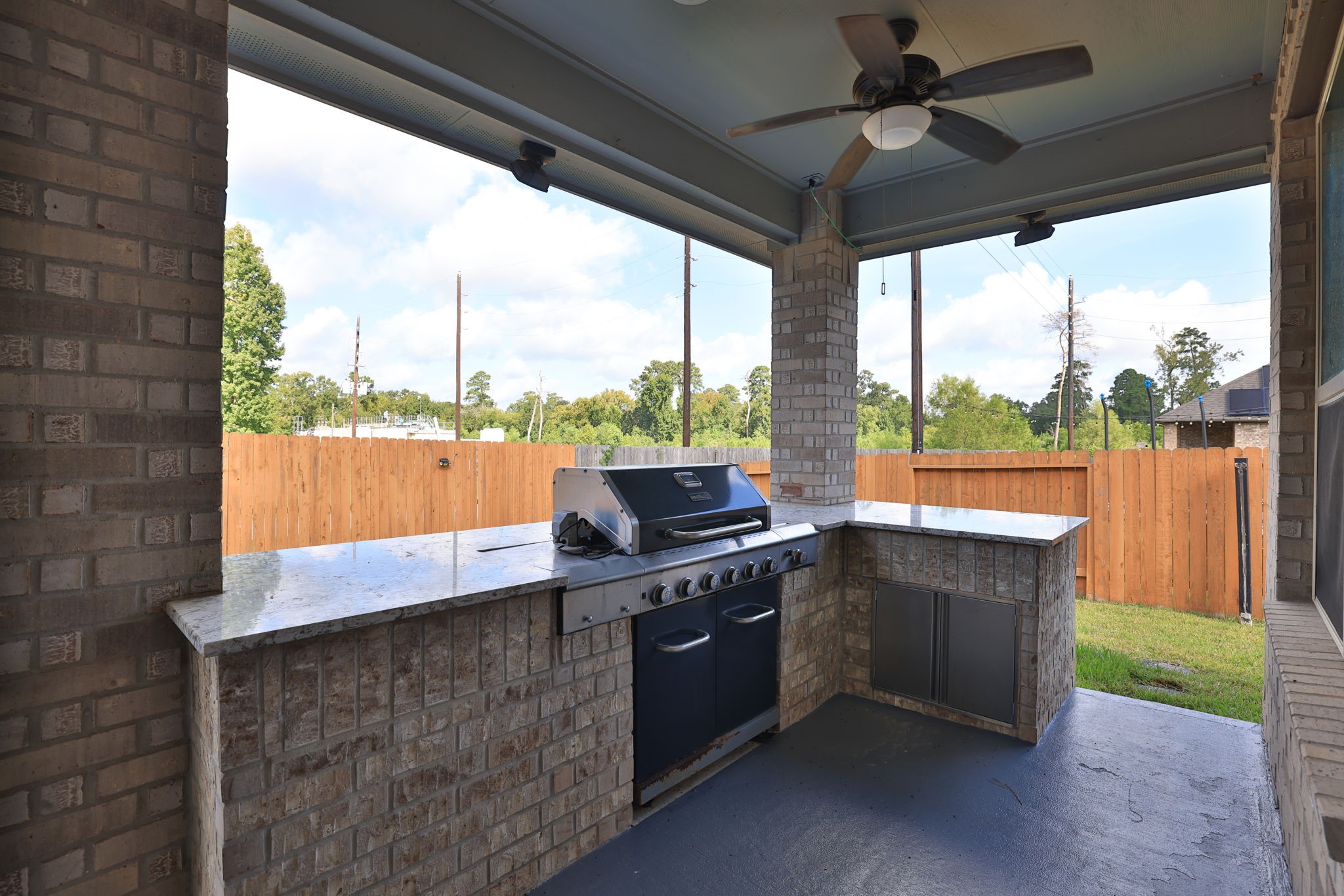 The outdoor kitchen is a must and perfect for entertaining! Enjoy grilling for the crowd in this private, quiet backyard