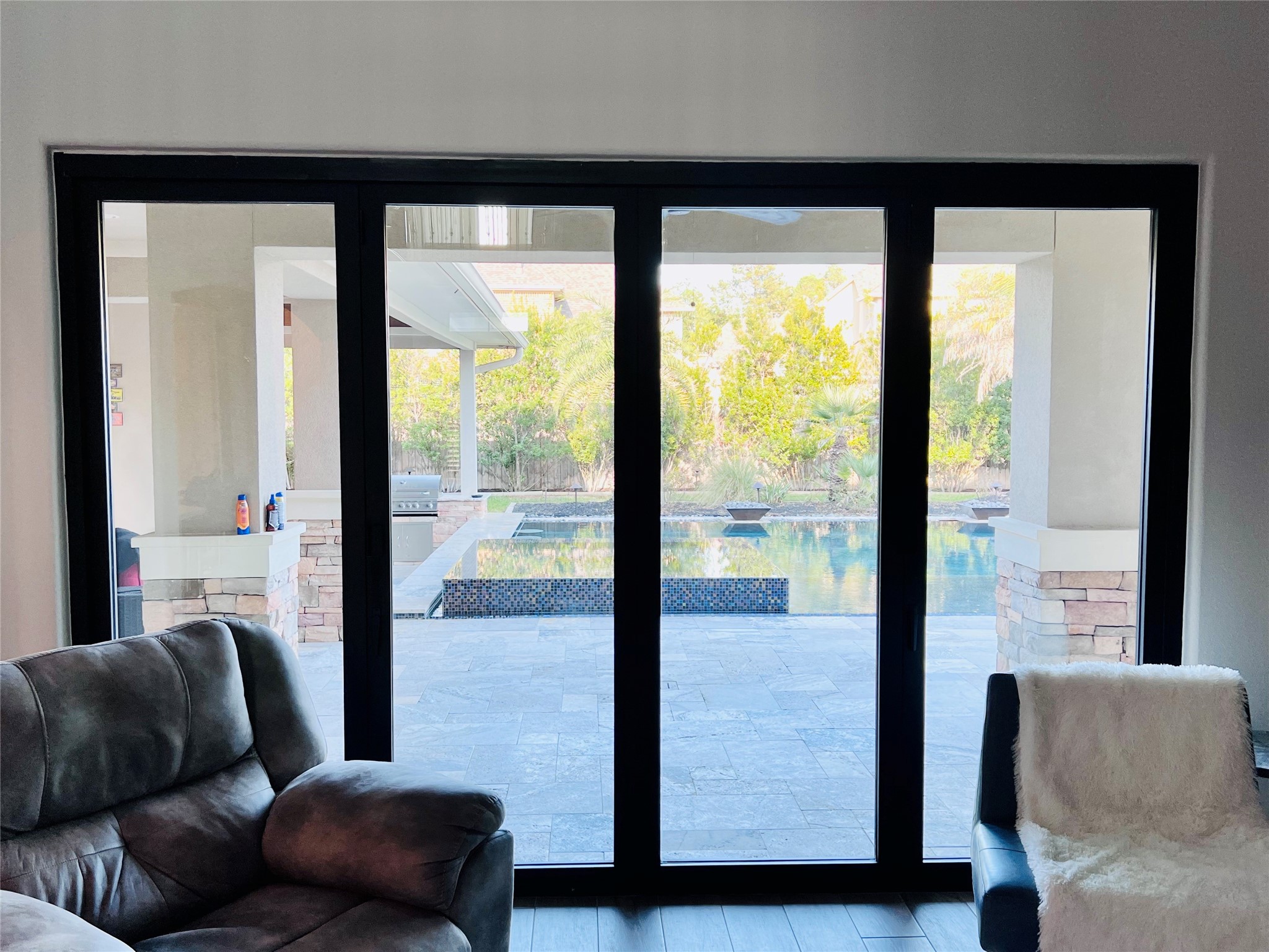 Bi-fold glass door opens to the patio