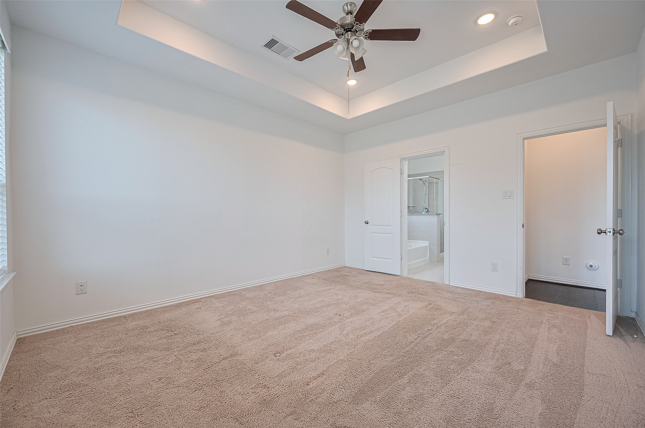 Spacious bedroom  includes an en-suite bathroom.