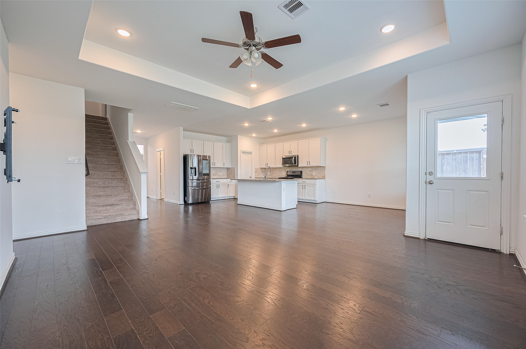 Living room features a staircase leading to the upper floor. Living room features a staircase leading to the upper floor.