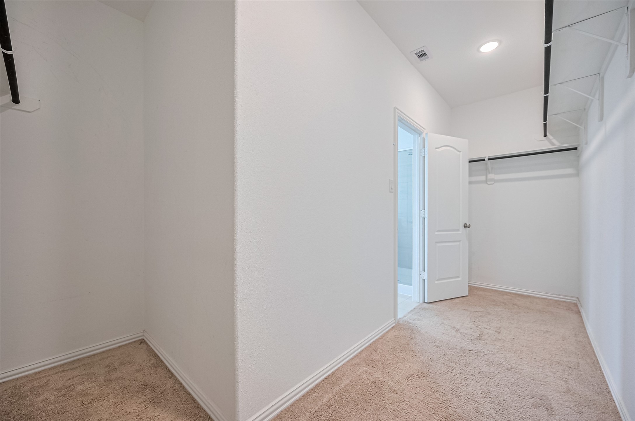 An open door leads to an adjacent room, enhancing accessibility and convenience.
