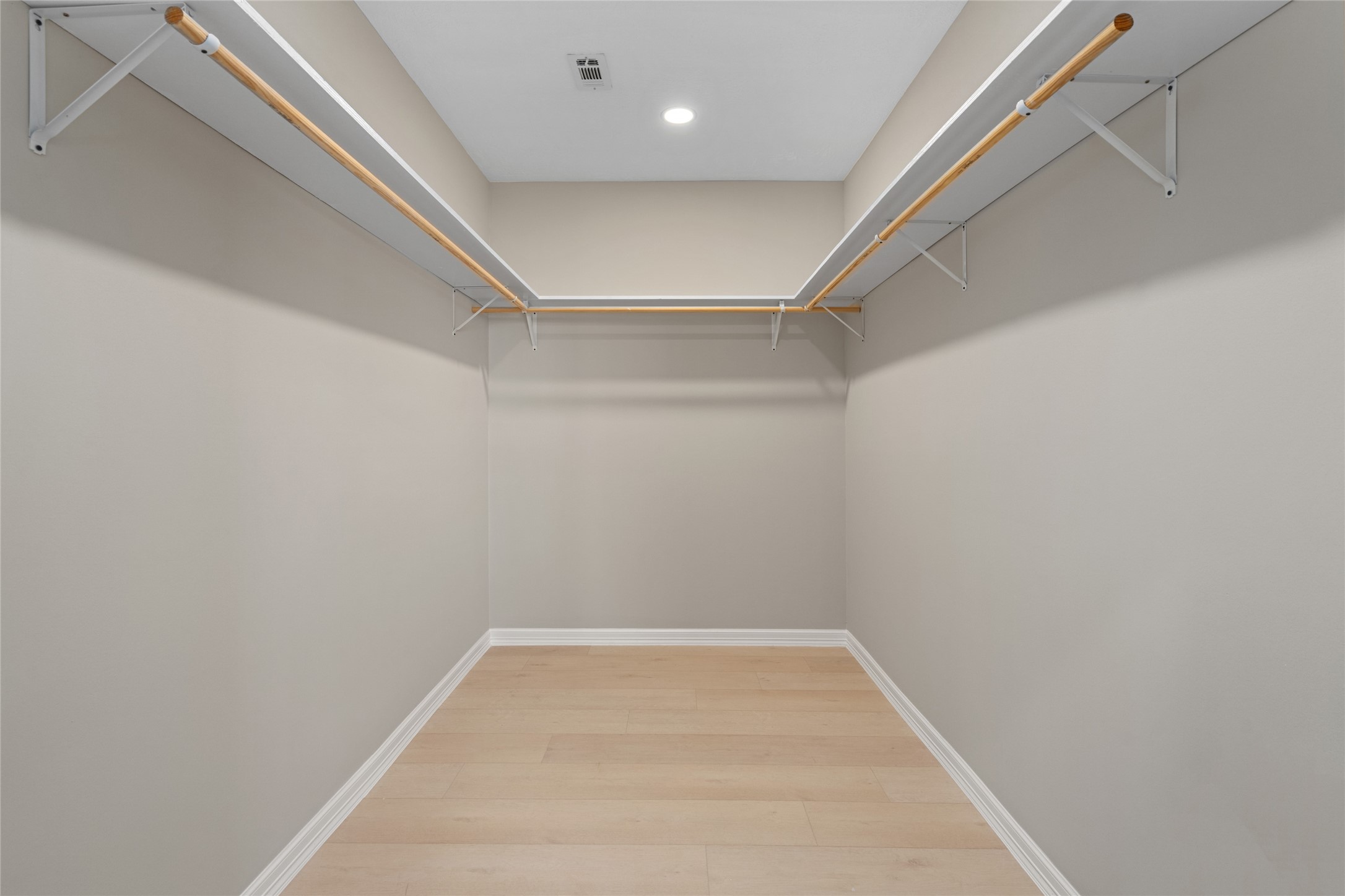 Expansive walk-in closet with
high ceilings and ample
shelving. Organized luxury
meets everyday convenience.