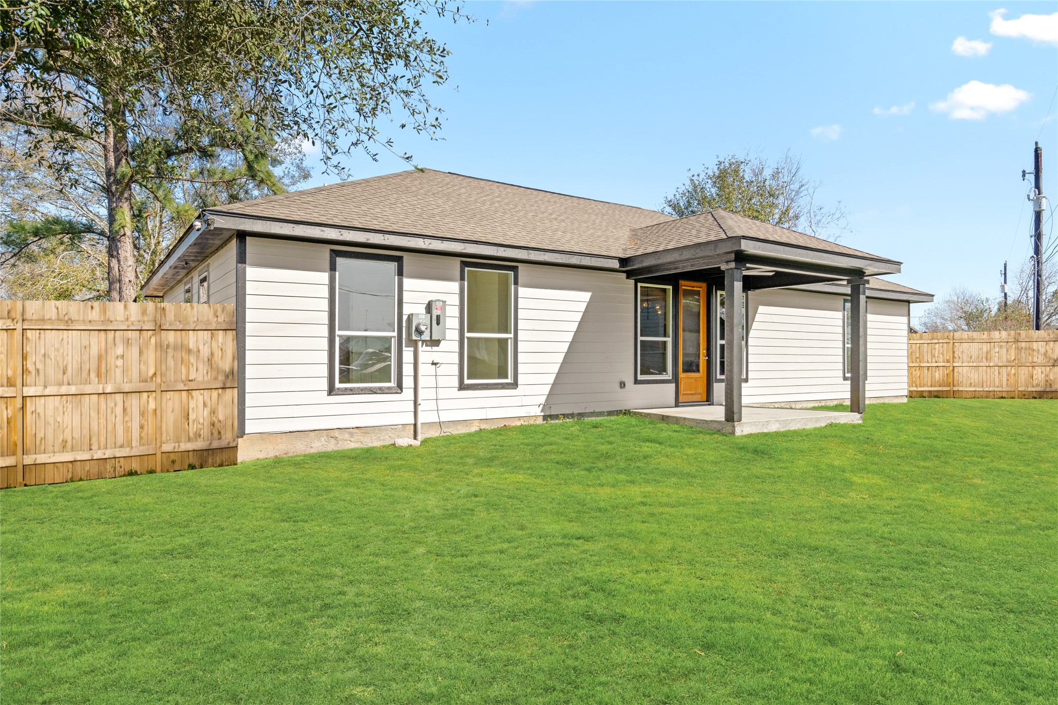 Spacious backyard view with a seamless blend of indoor-outdoor living, ideal for family fun or weekend gatherings.