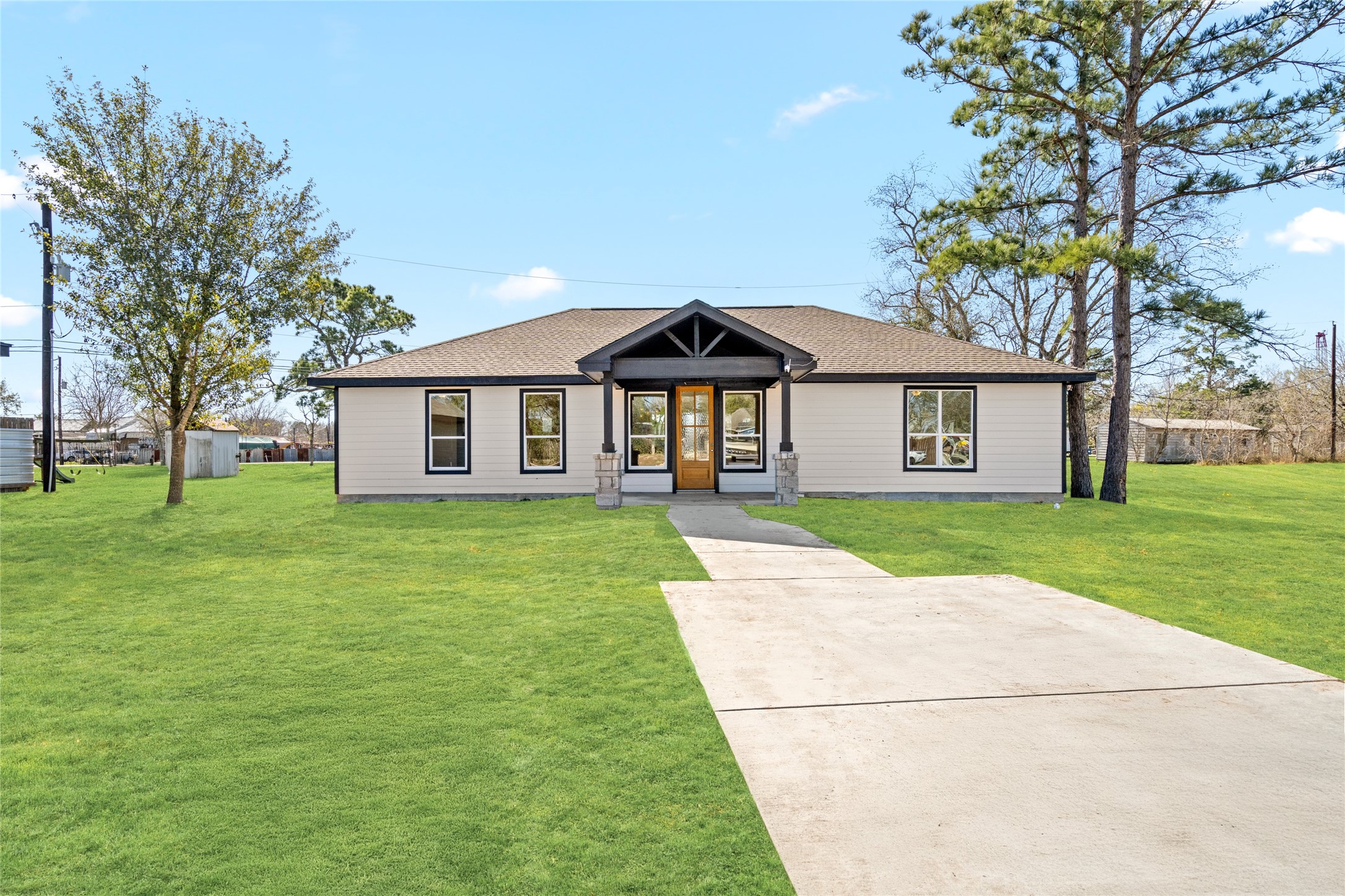 Bathed in natural daylight,
this front view showcases the
homes clean lines,
manicured lawn, and
charming covered porch,
perfect for morning coffee or
evening relaxation.