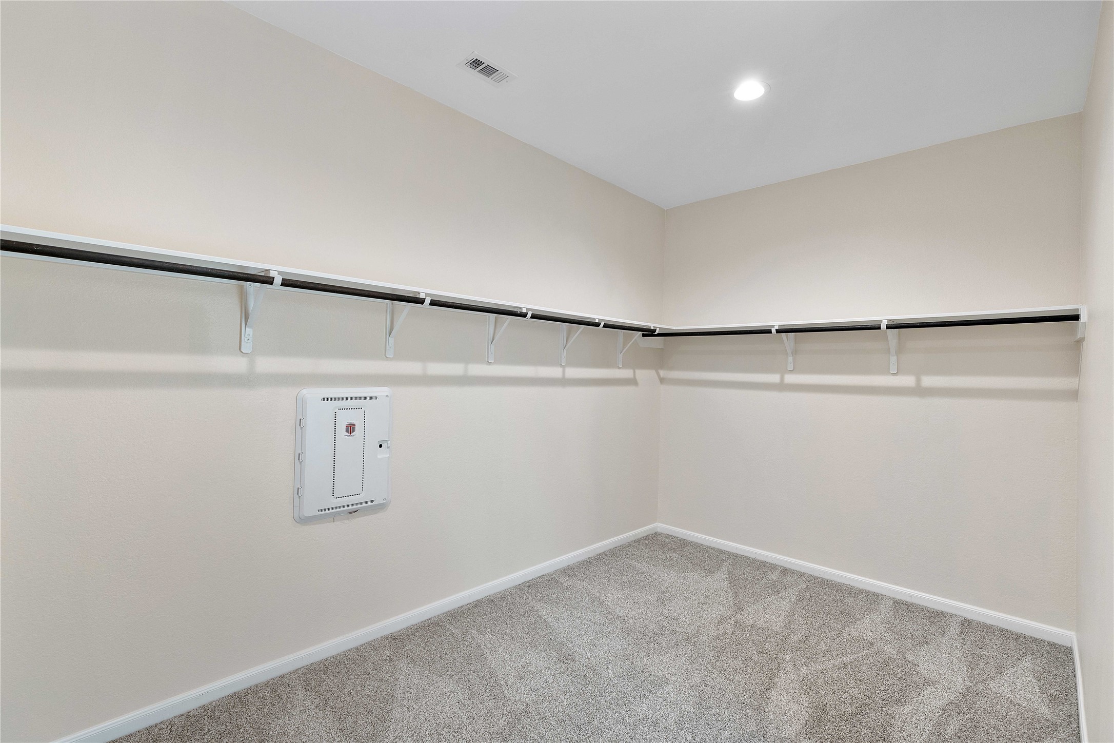 Primary bedroom walk in closet
