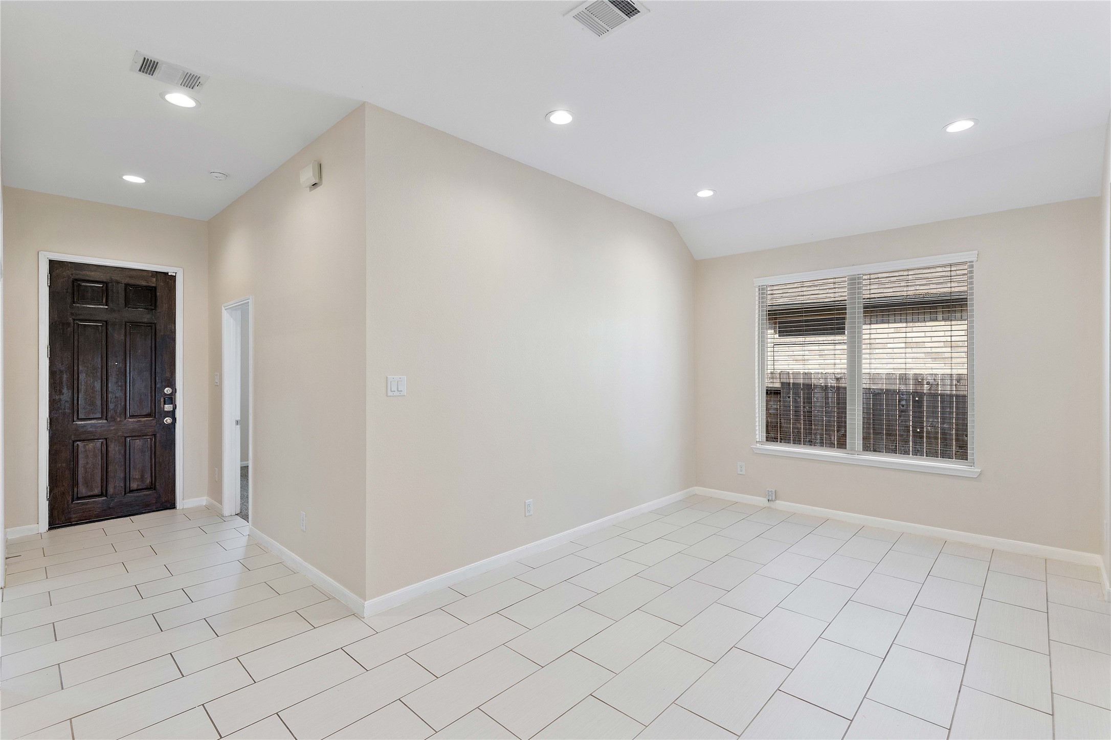 Step into a bright, inviting foyer with seamless flow into an elegant dining area, perfect for entertaining.