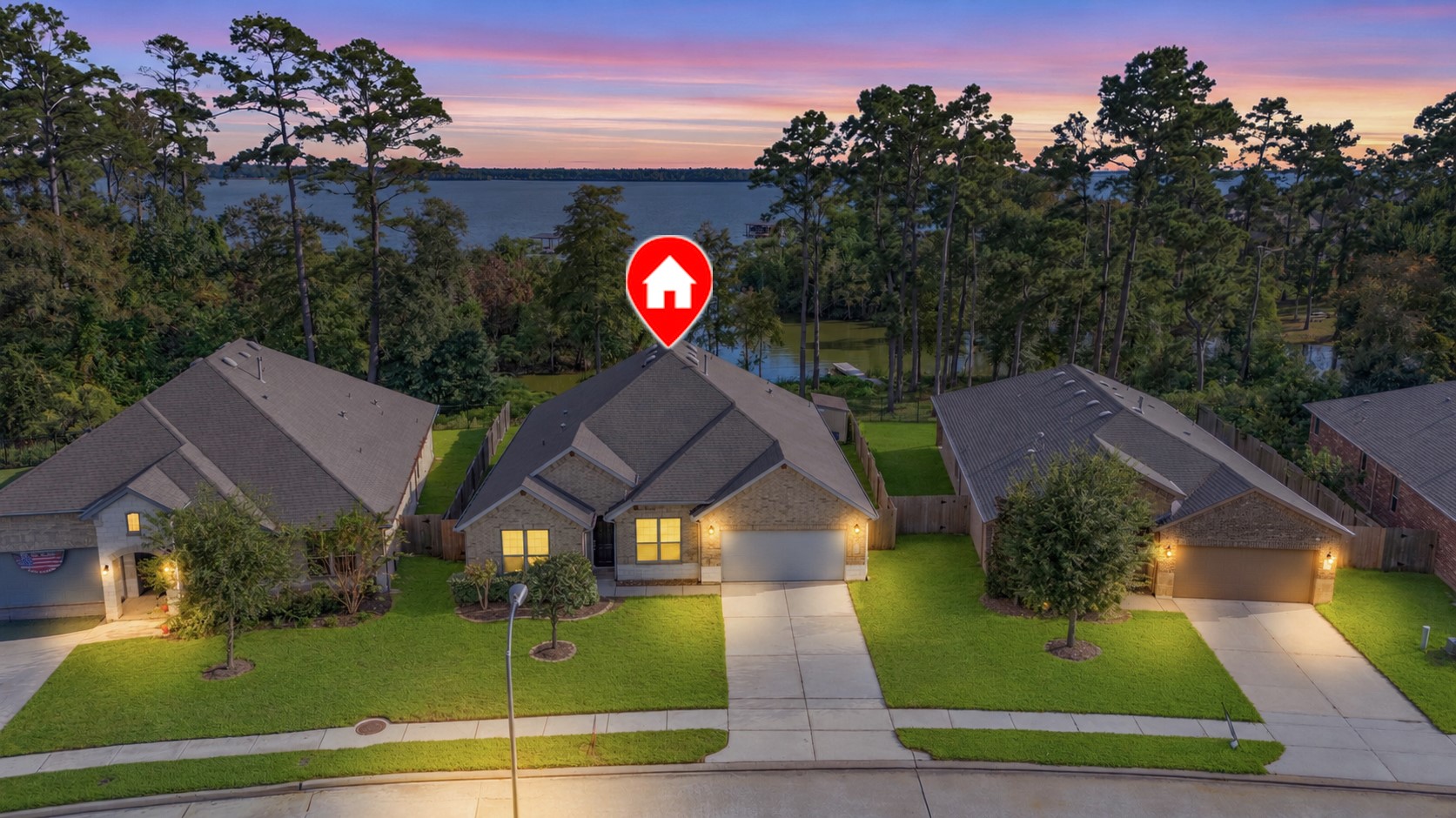 Charming single-story home nestled in a serene lakeside neighborhood, offering picturesque sunset views and a beautifully maintained yard.