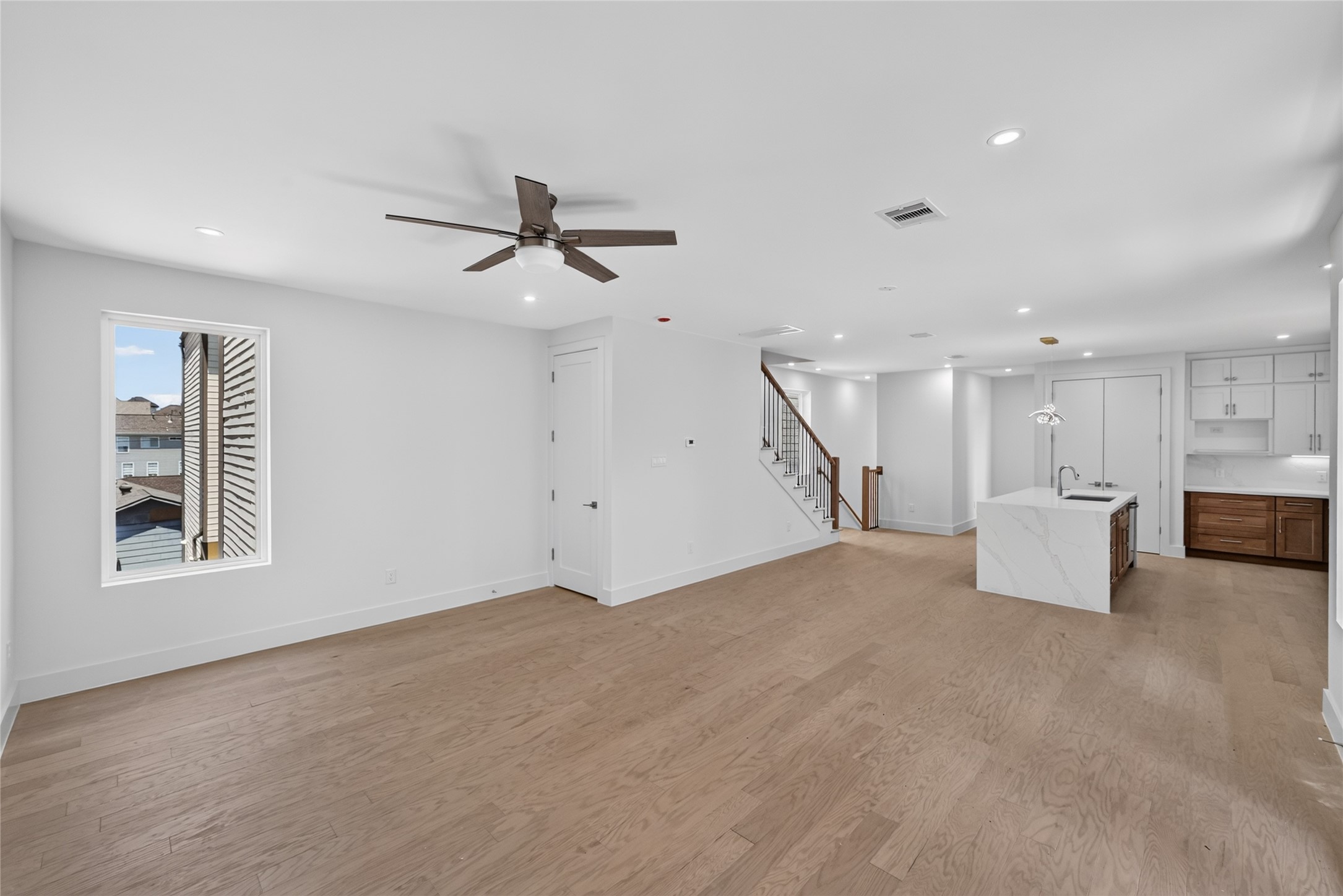 Spacious living room area that's opened to the kitchen and dinning area