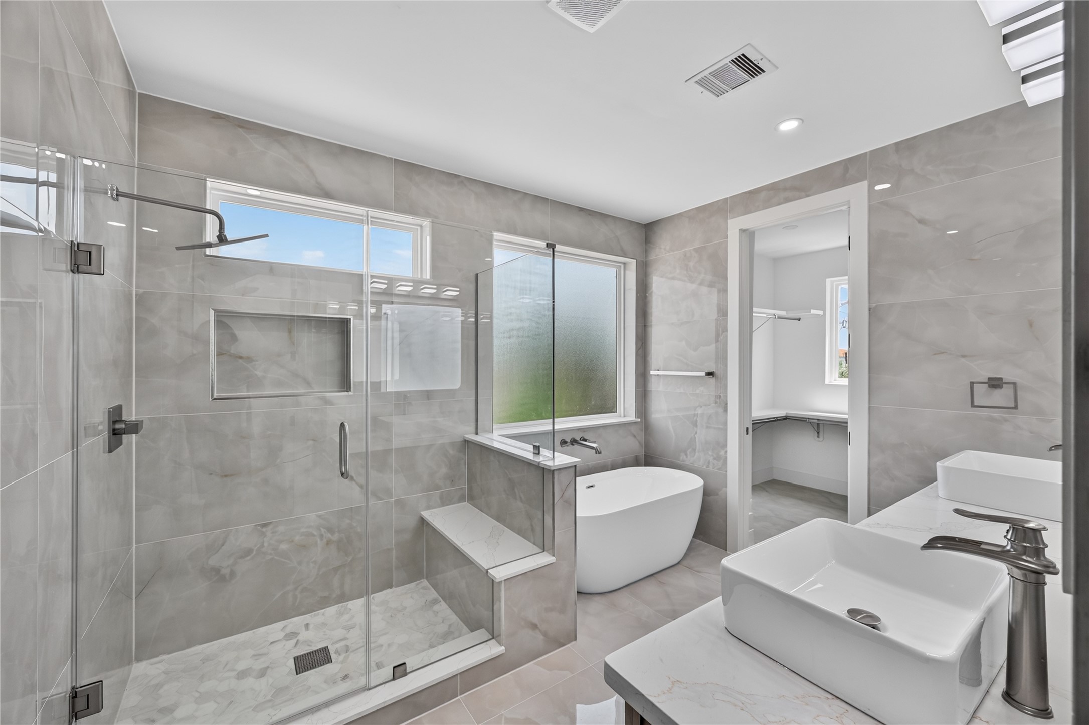 Separate frameless glass shower with built in bench