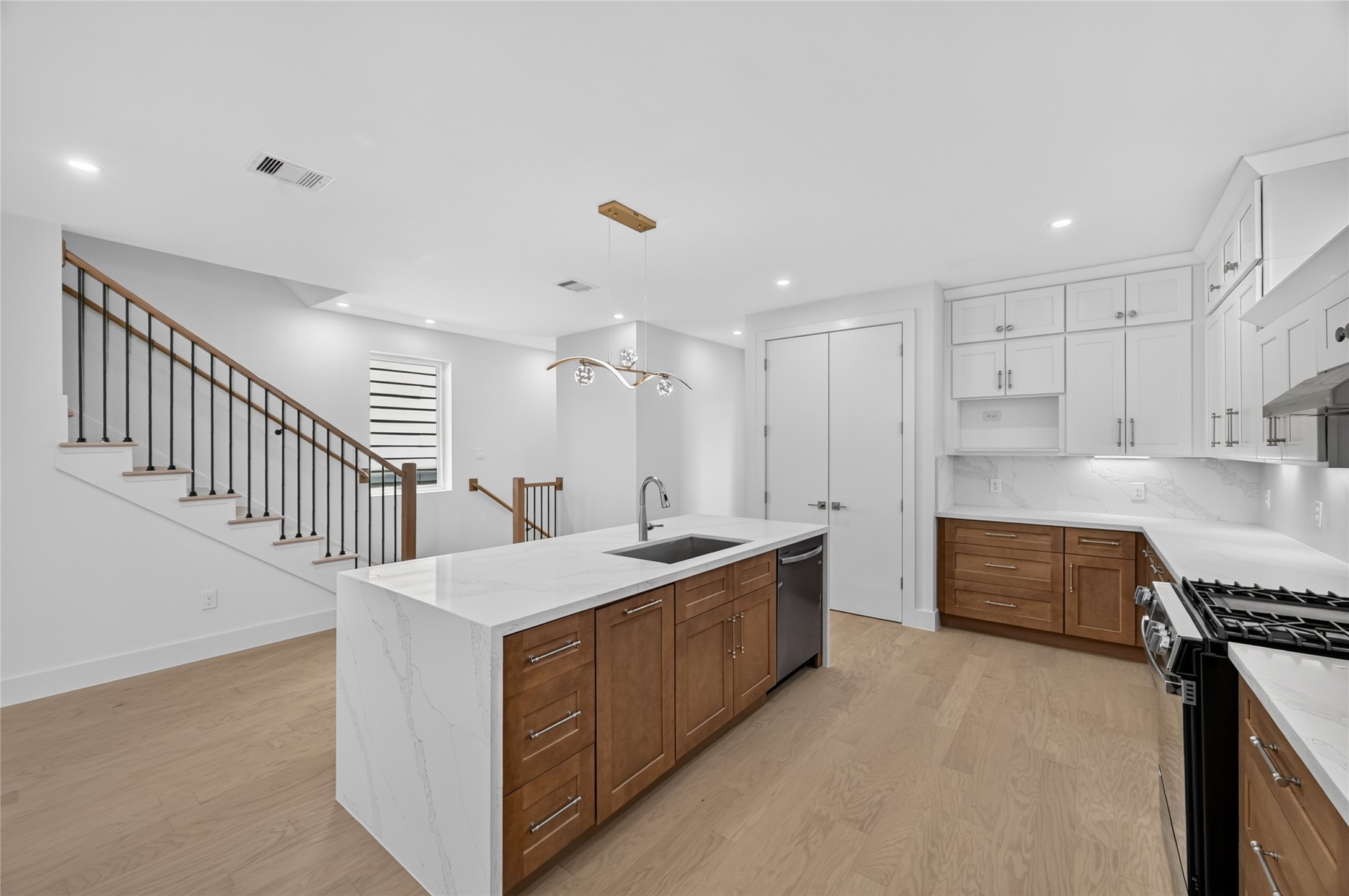 Another view of the beautiful duo toned kitchen cabinets