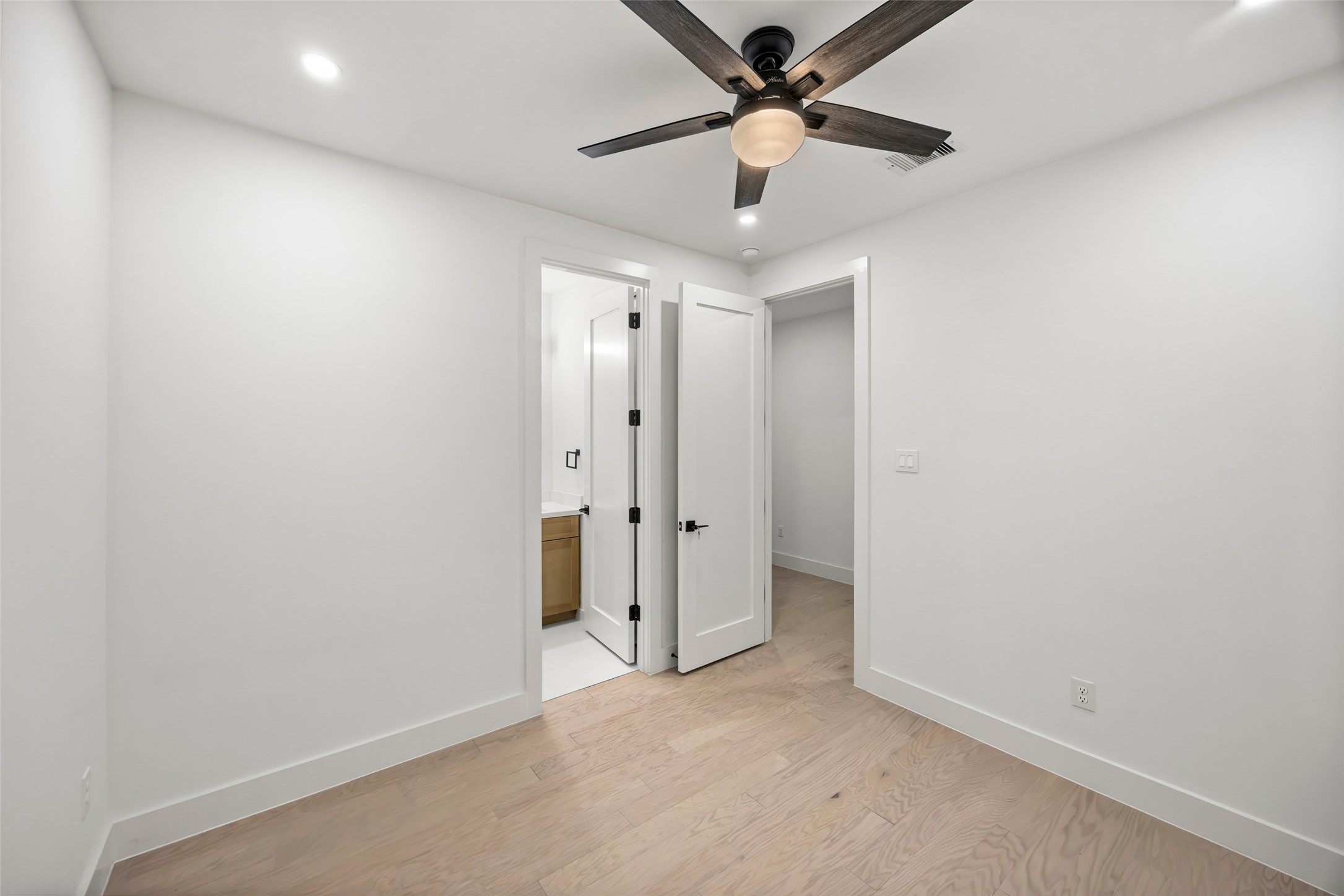 Secondary bedroom located by the entryway of the first floor