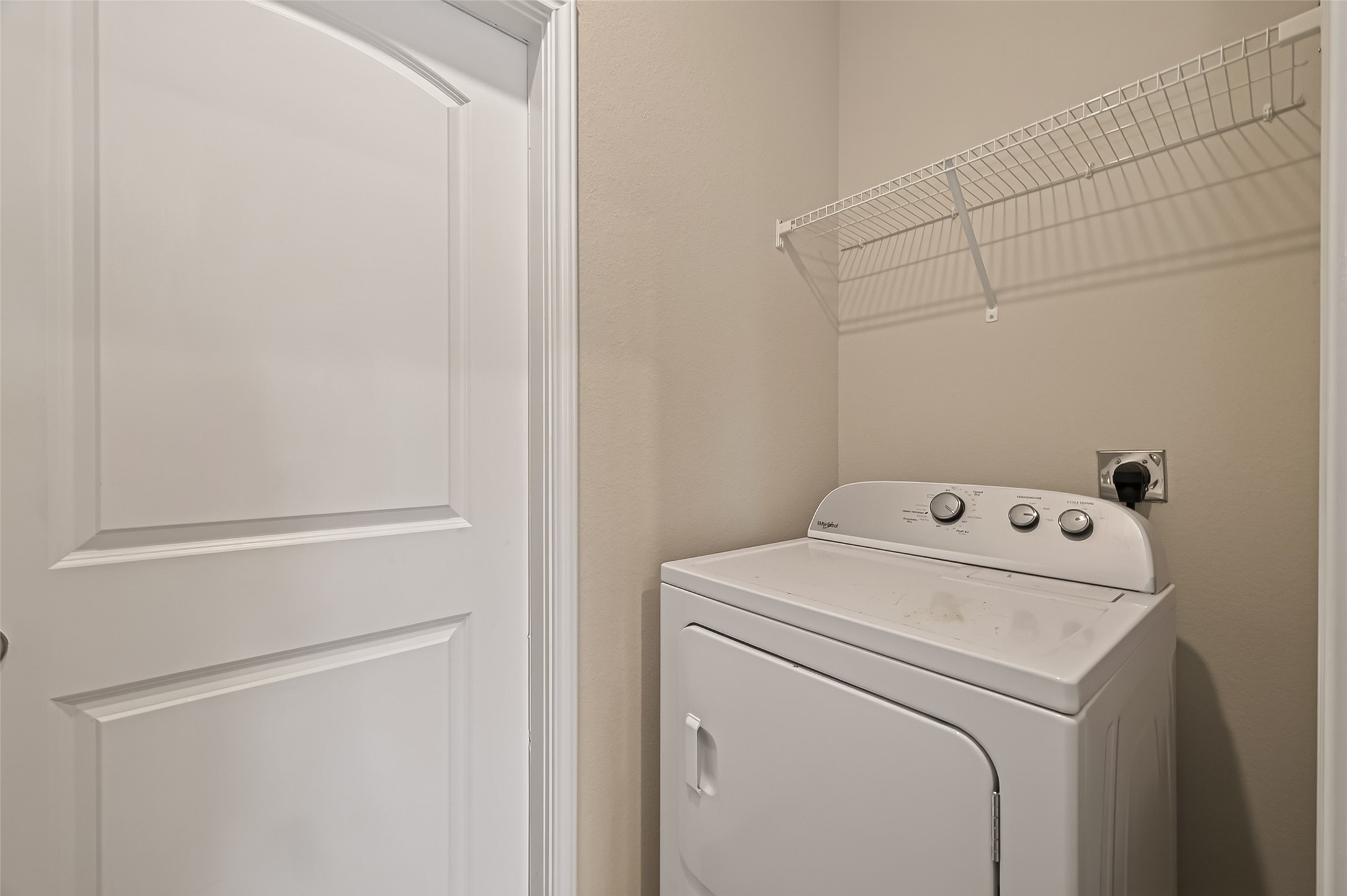 Washer & Dryer are located between the kitchen & garage.