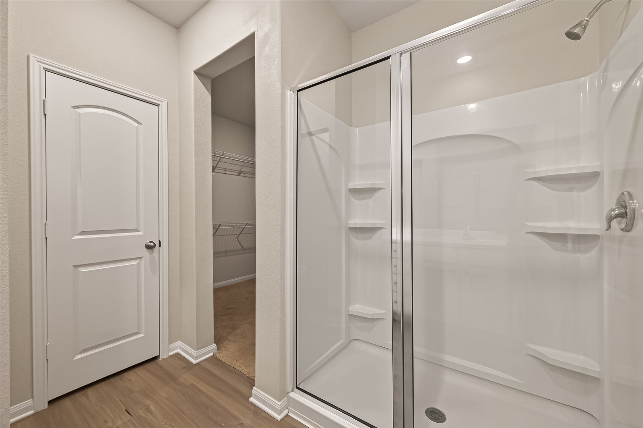 Large walk in closet and large walk in shower.