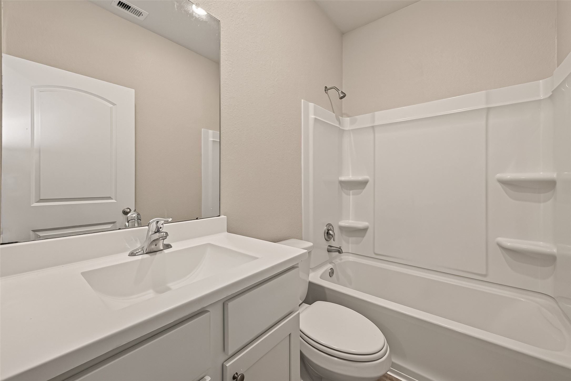 Full bath with tub/shower combo.