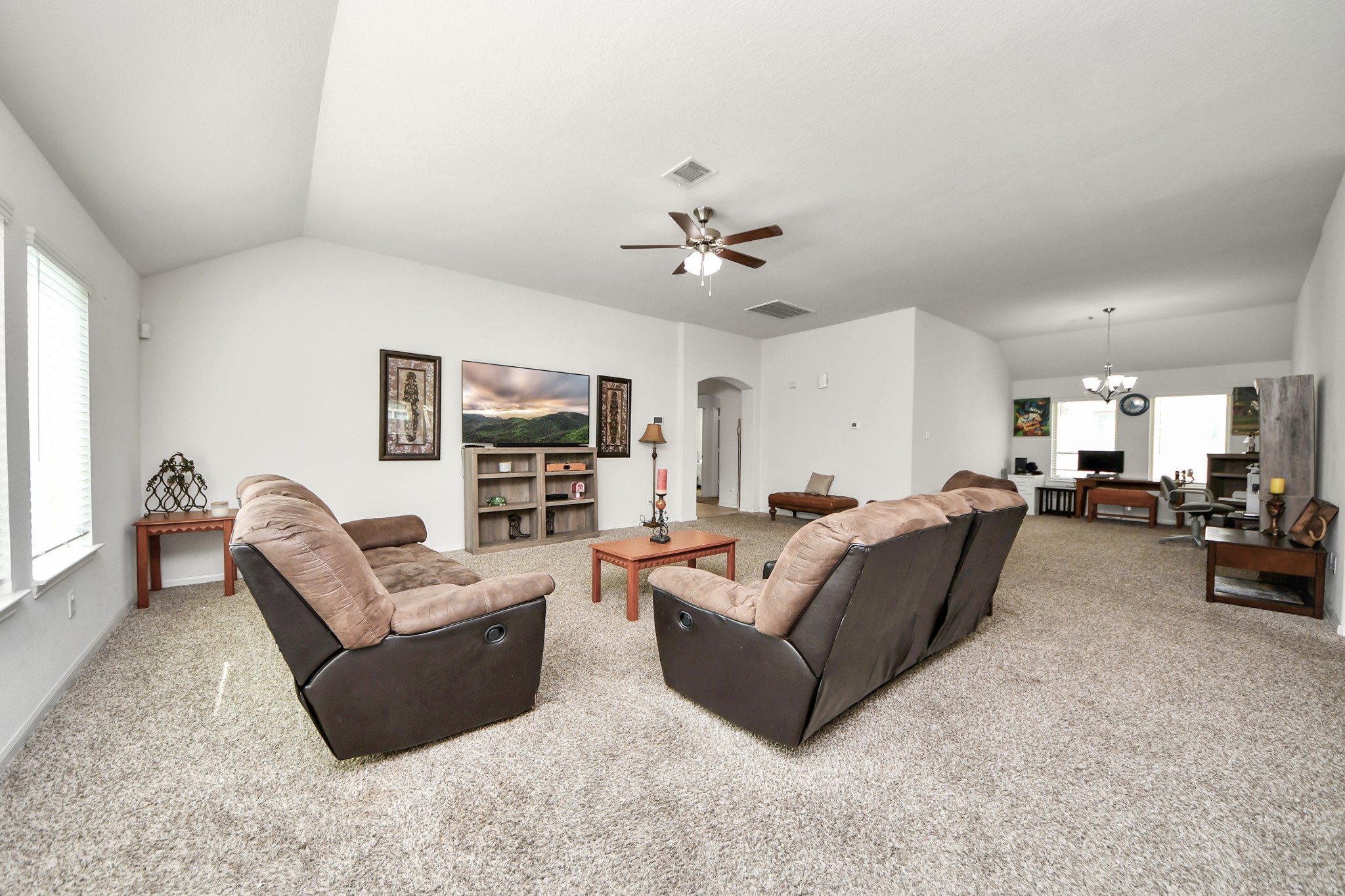 Family room with a view of the flex space to the side Family room with a view of the flex space to the side