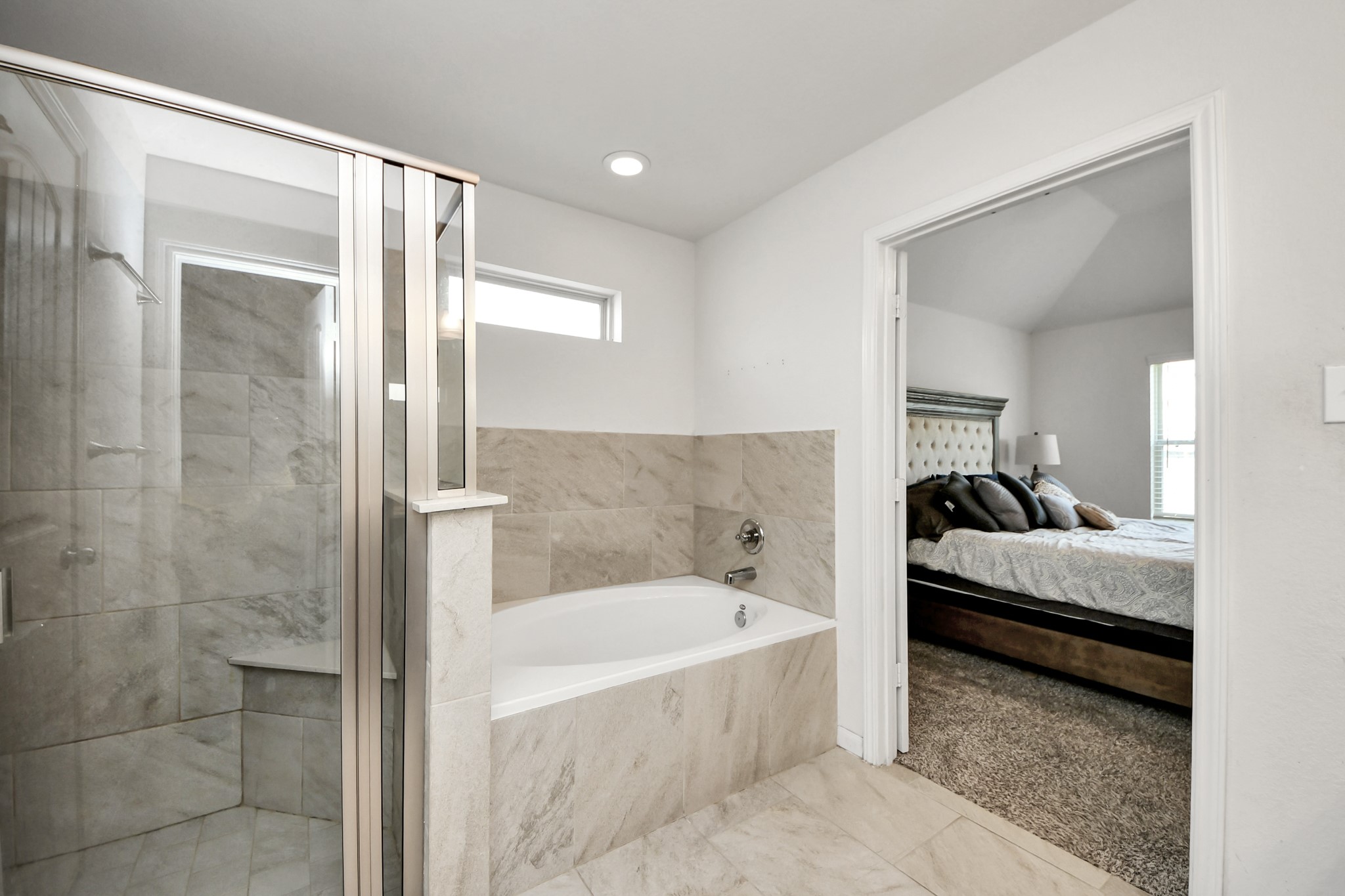 Primary bathroom with separate tup and shower combo