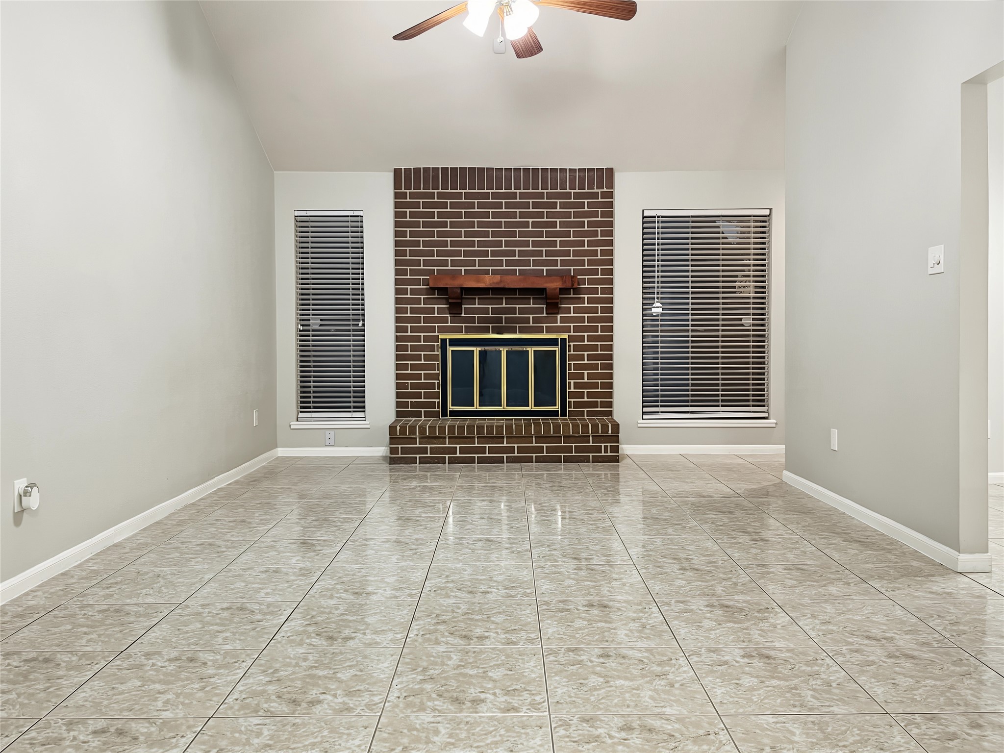 Great view of the spacious living room area and the fireplace. Great view of the spacious living room area and the fireplace.