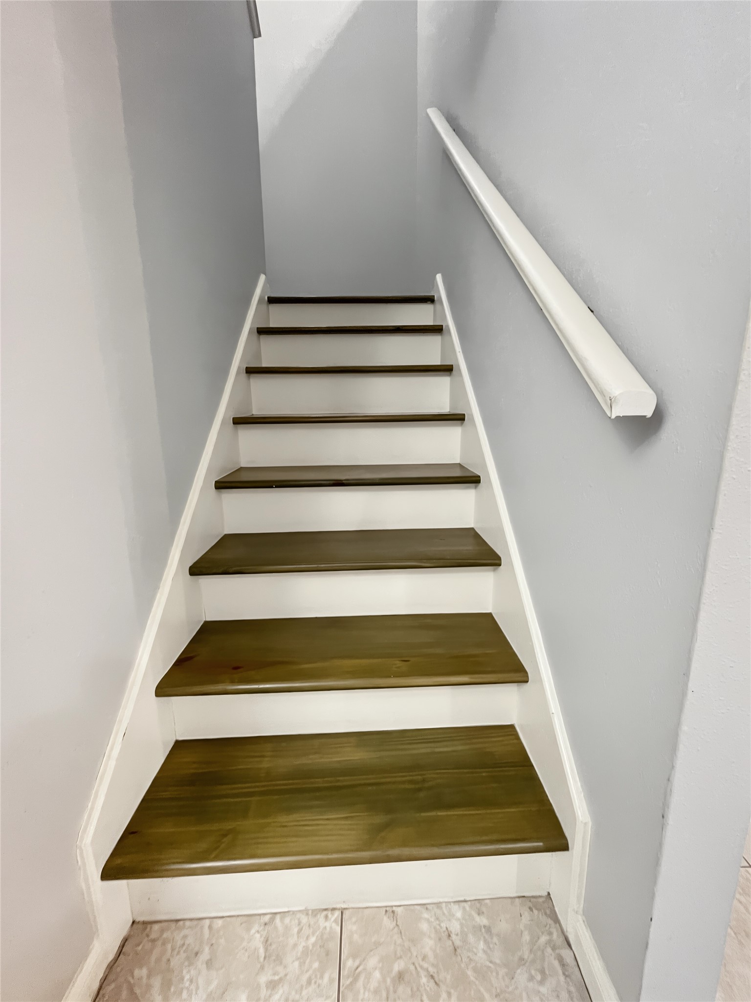View of the hardwood steps in this amazing house.