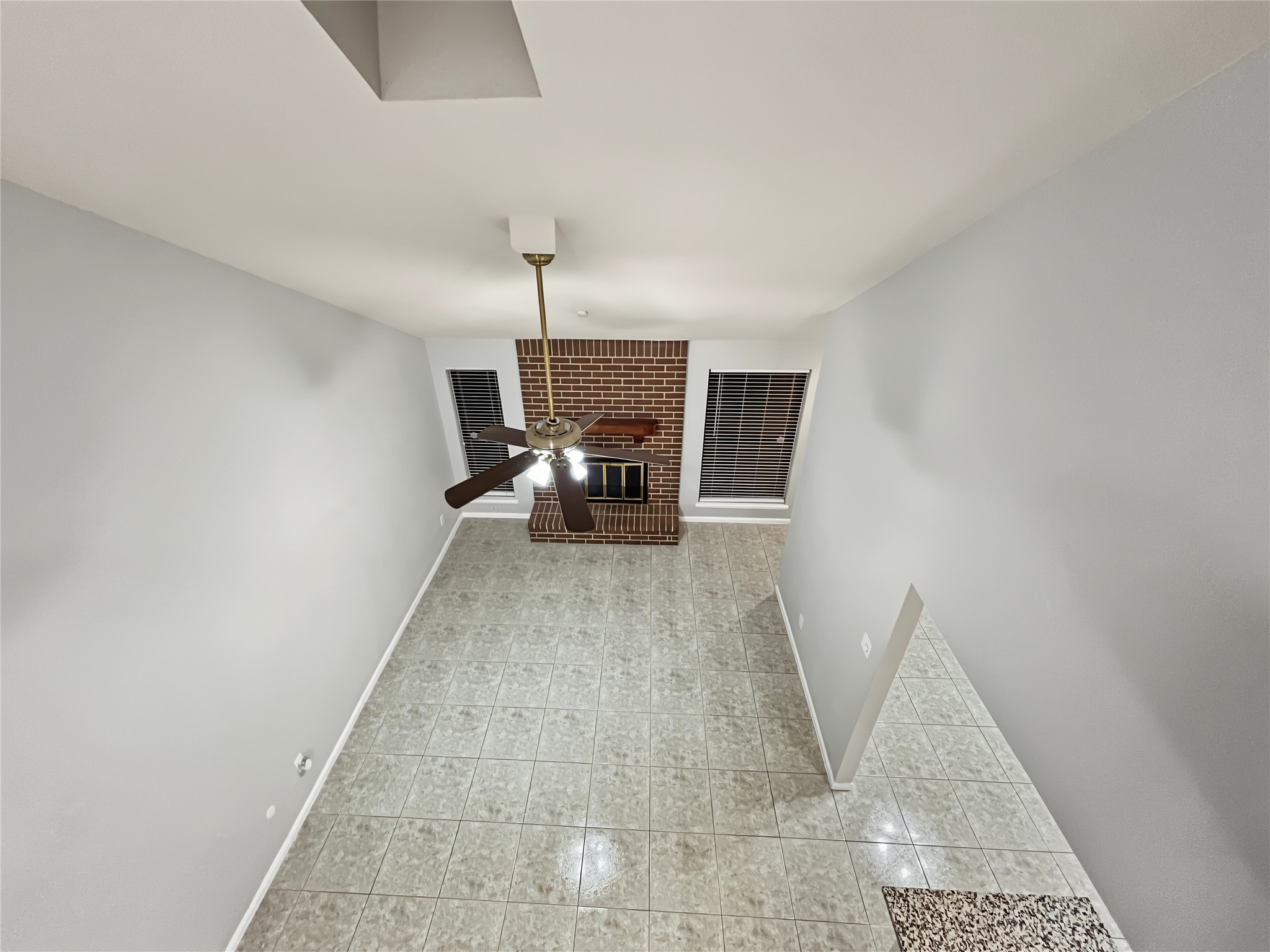 View from the loft to the living room and kitchen.