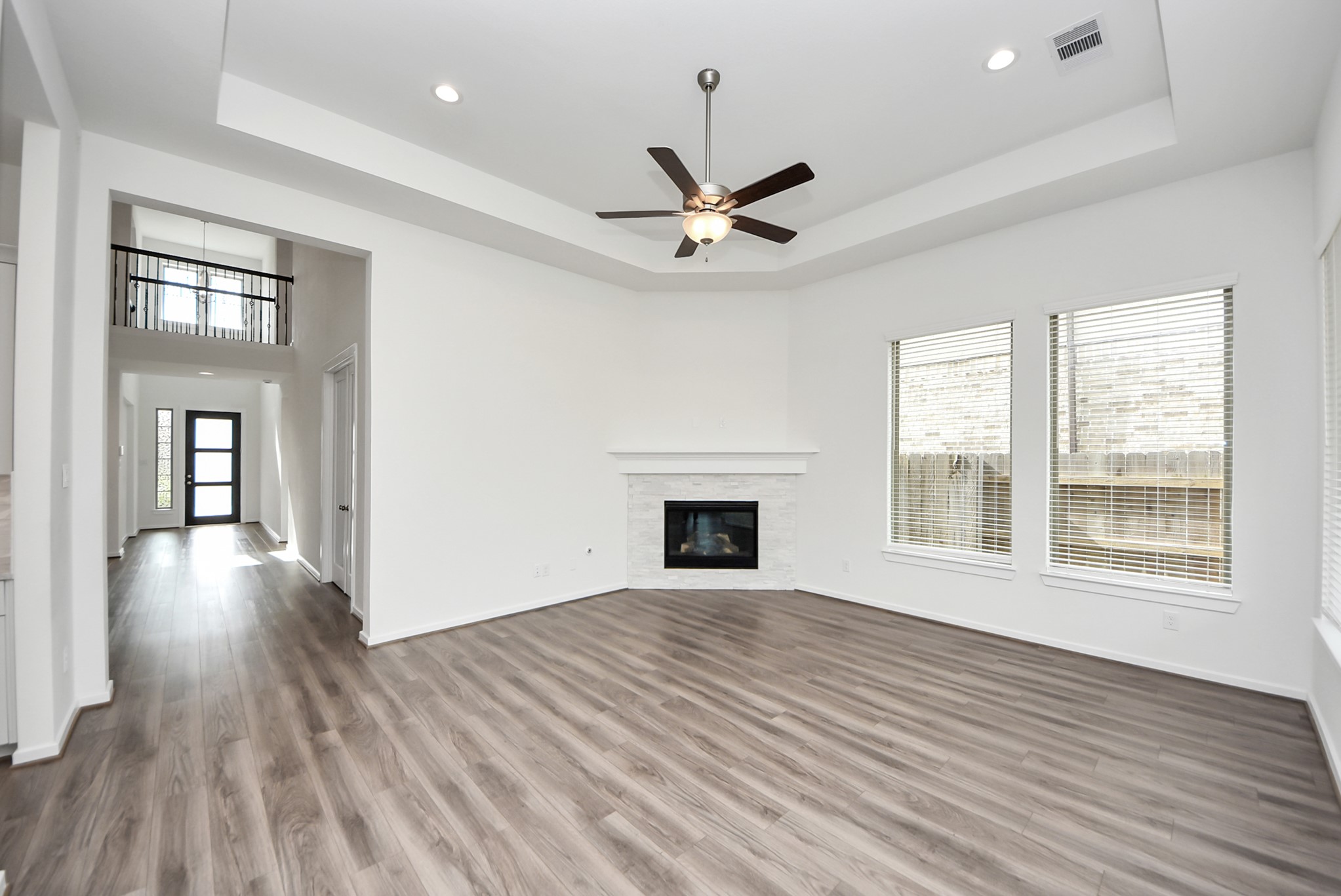 Living room with view of entryway.