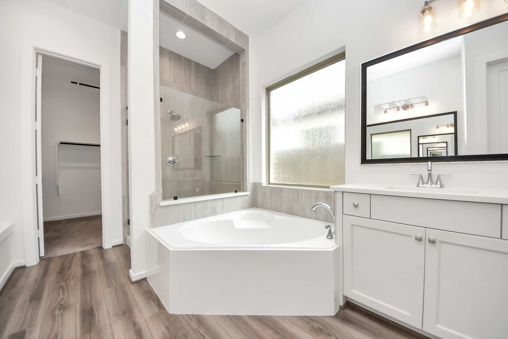 Primary bathroom soaking tub and separate shower