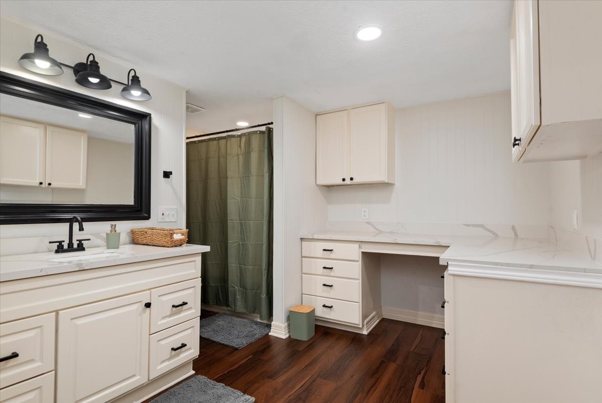 Built-in cabinetry provides additional storage in the restroom.