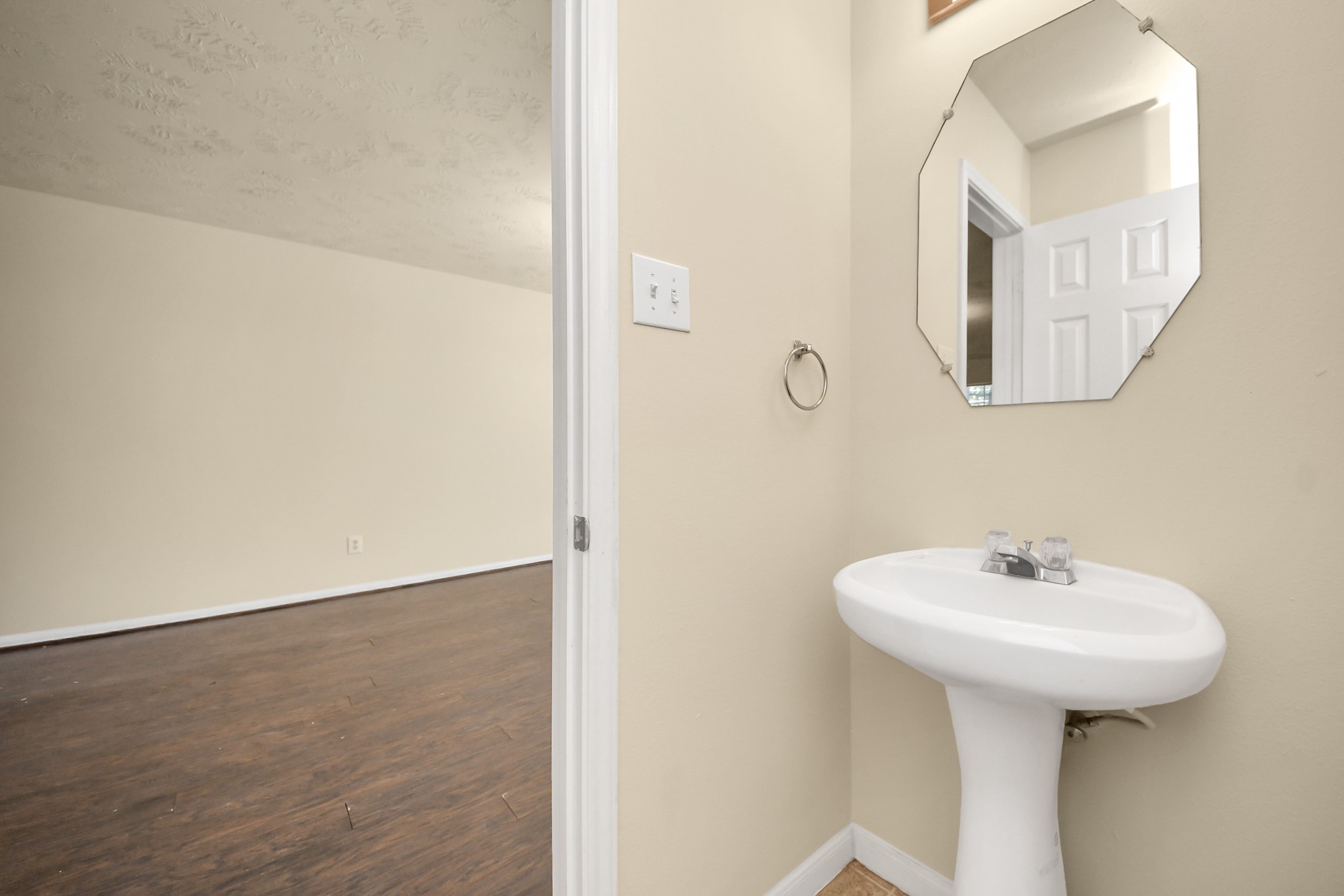 Half bathroom on the first floor, adjacent to the living and dining room.