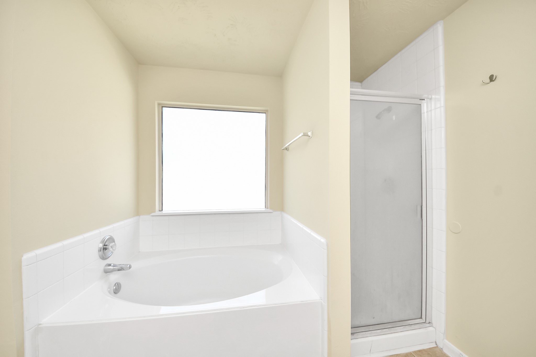 Relaxing soaking tub next to a convenient walk-in shower.