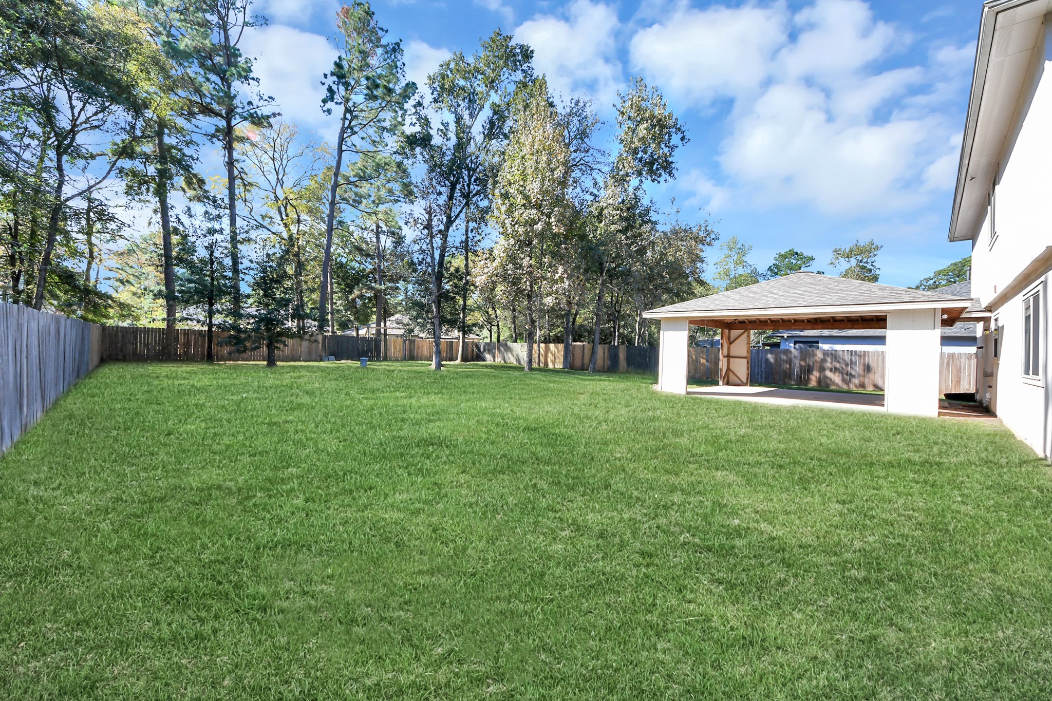 Completely fenced, perfect for outdoor gatherings. Photo: AI assisted for grass growth.